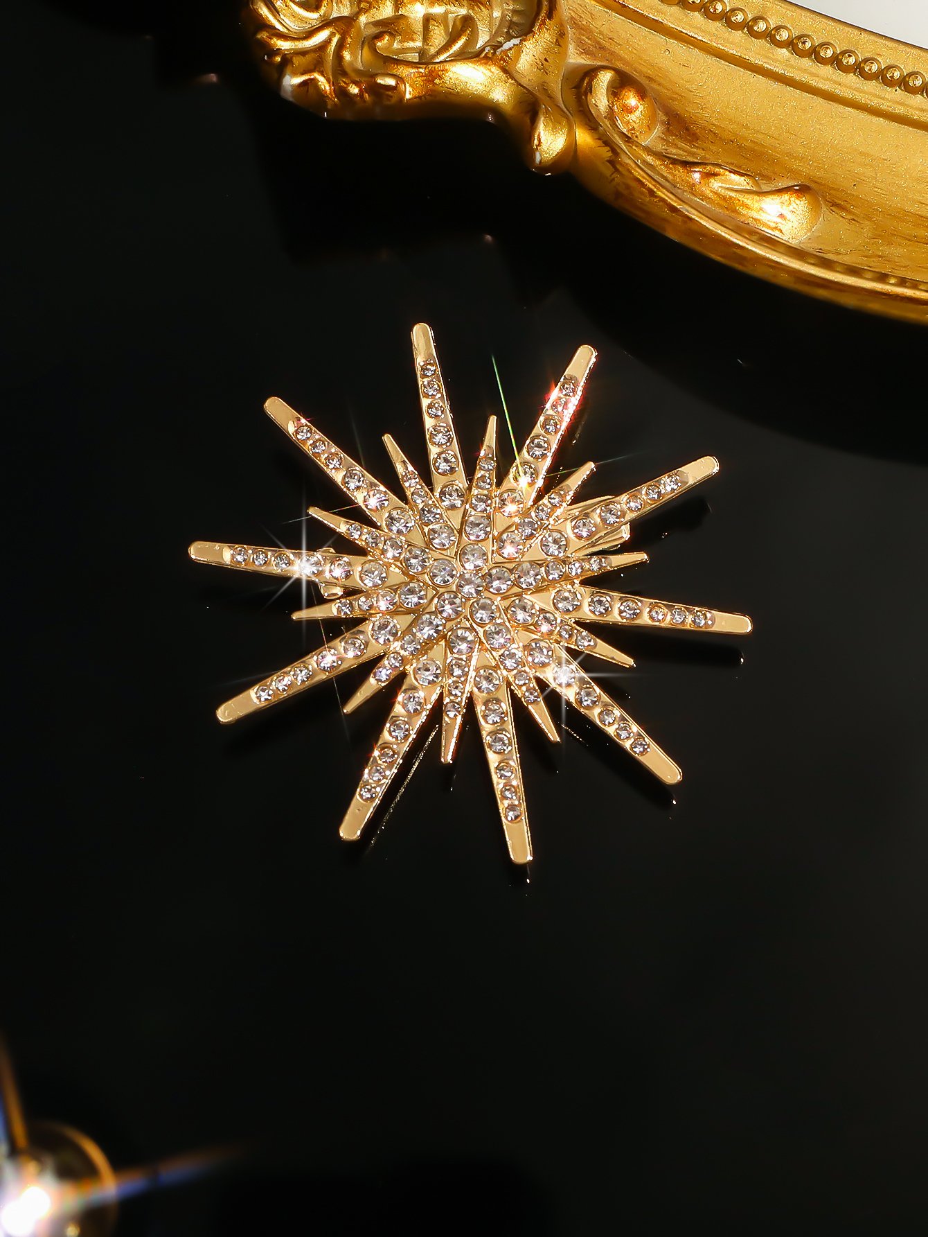 Radiant Gold Starburst Brooch