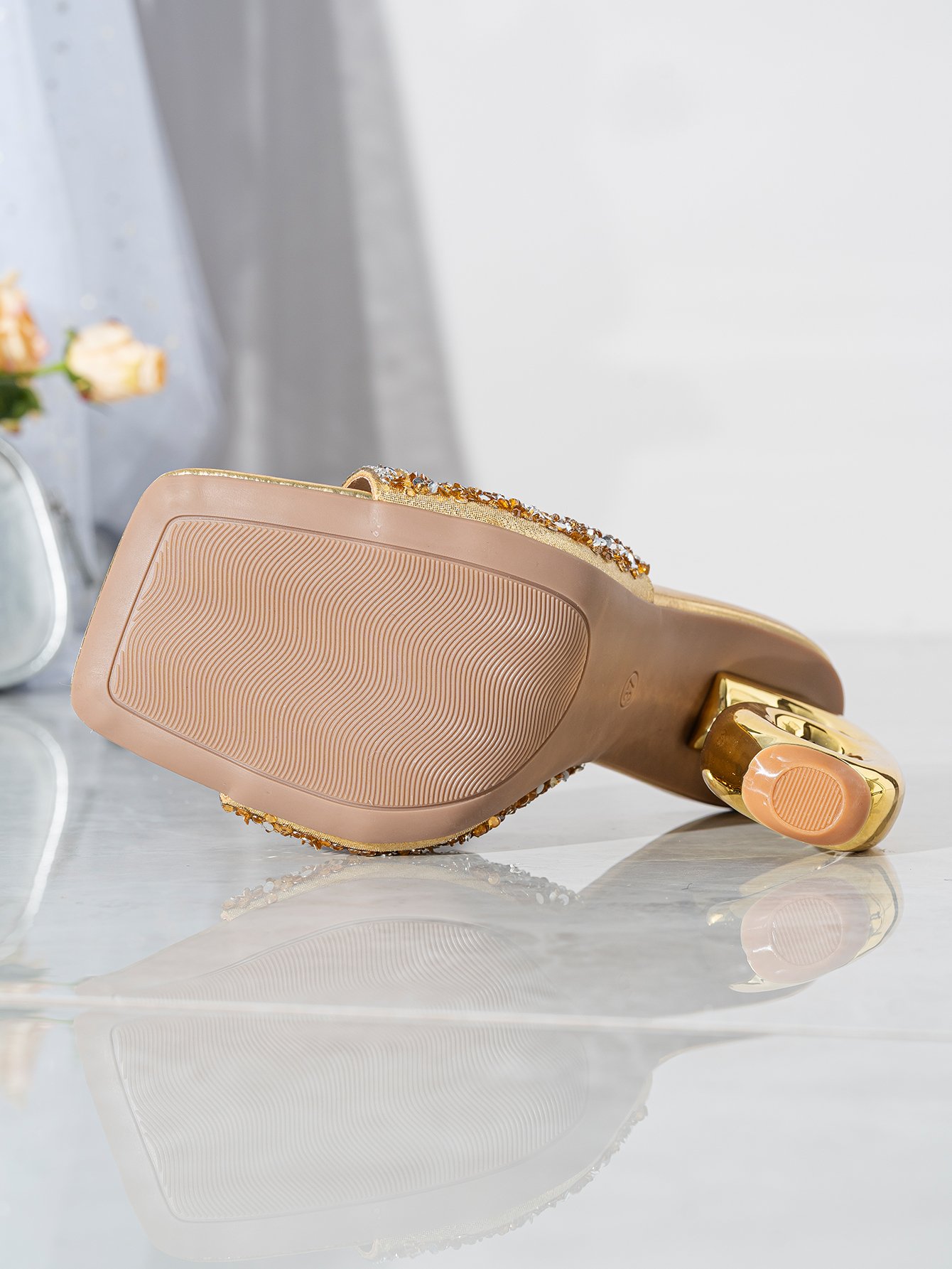 Dazzle in these Gold High Heels, adorned with sparkling embellishments and a unique heel, perfect for glamorous occasions.