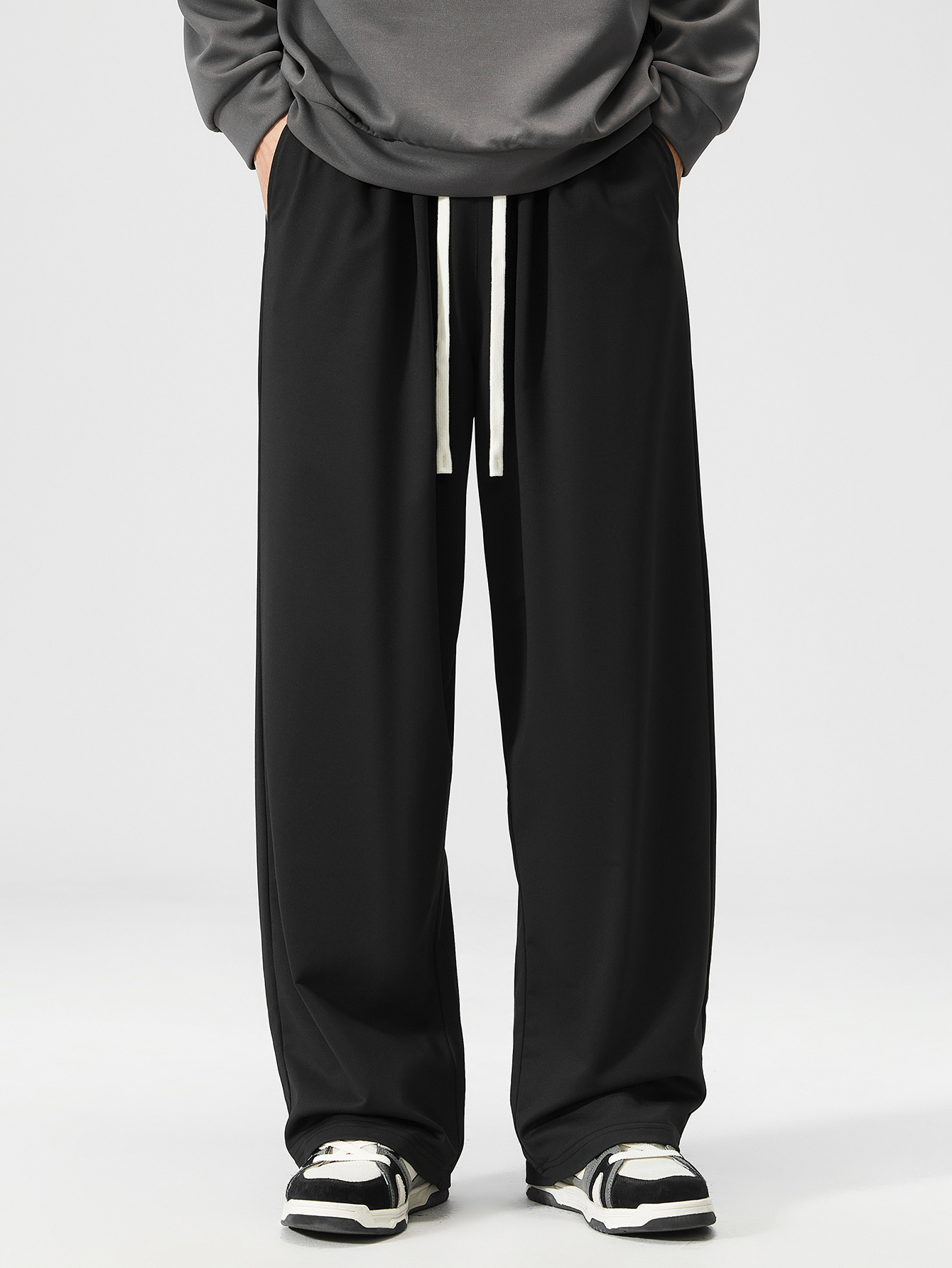 Black Knitted Mid Rise Drawstring Waist Trousers