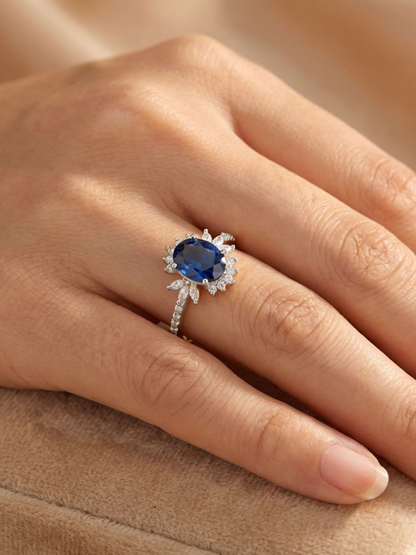 Silver Plated Oval Blue Zircon Ring with Floral CZ Accent