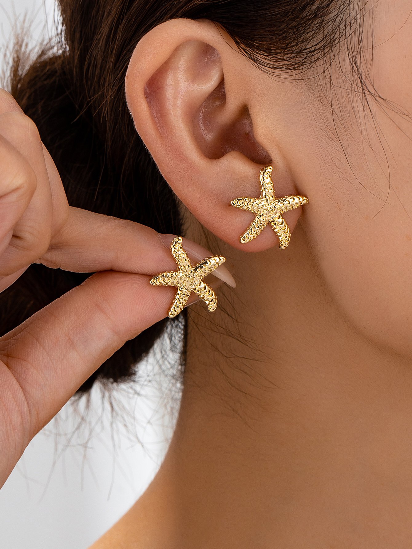 Gold Starfish Stud Earrings for Casual Wear.