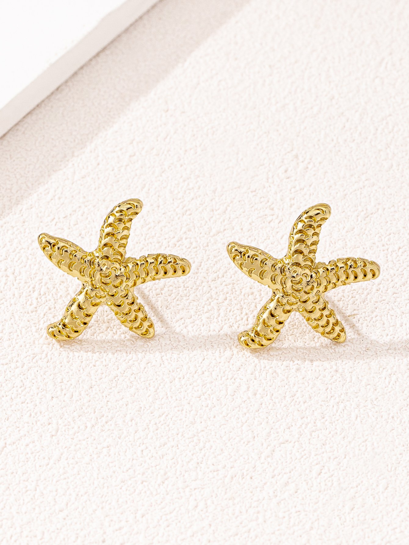 Gold Starfish Stud Earrings for Casual Wear.