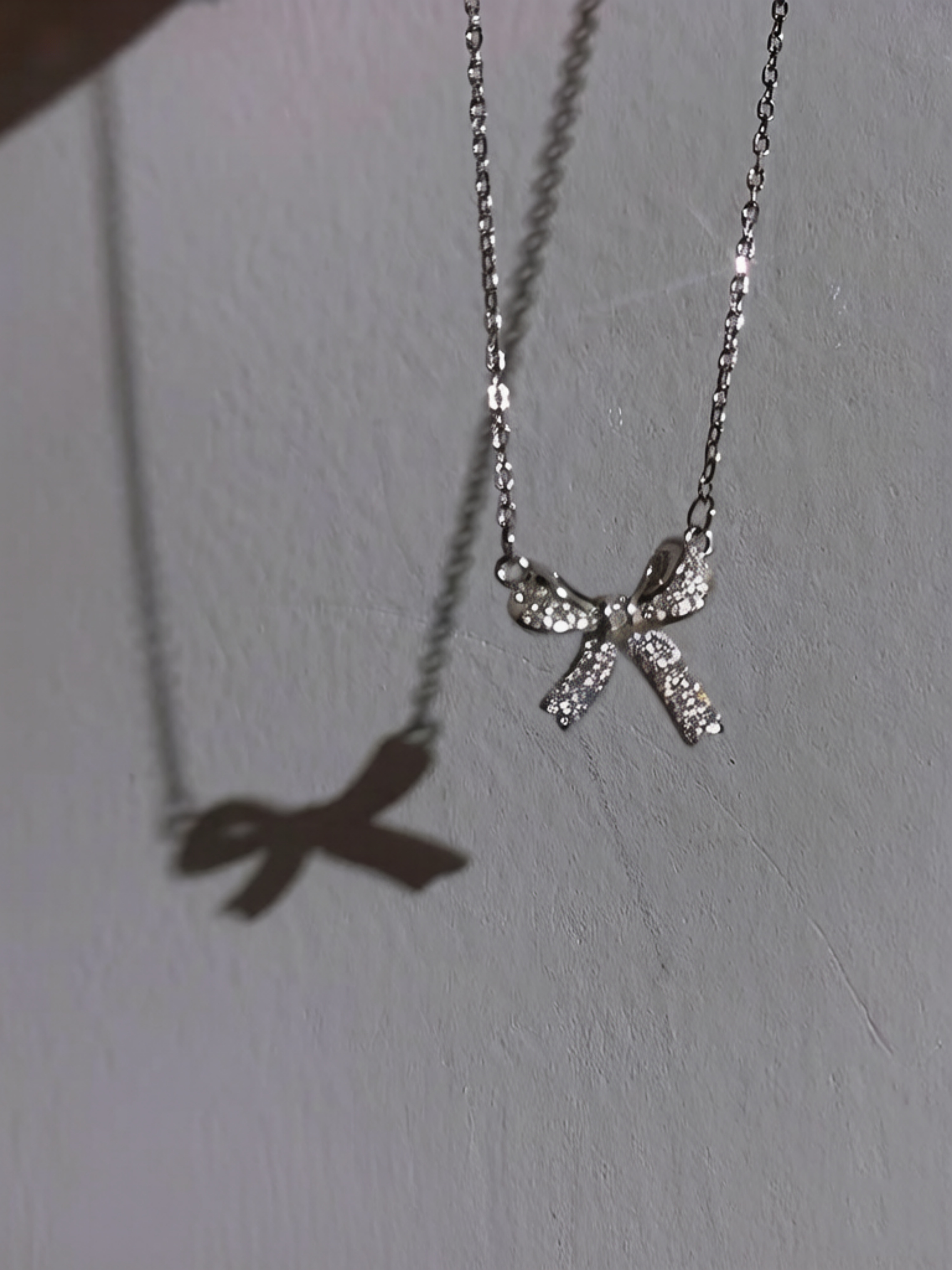 Silver Bow Pendant Necklace