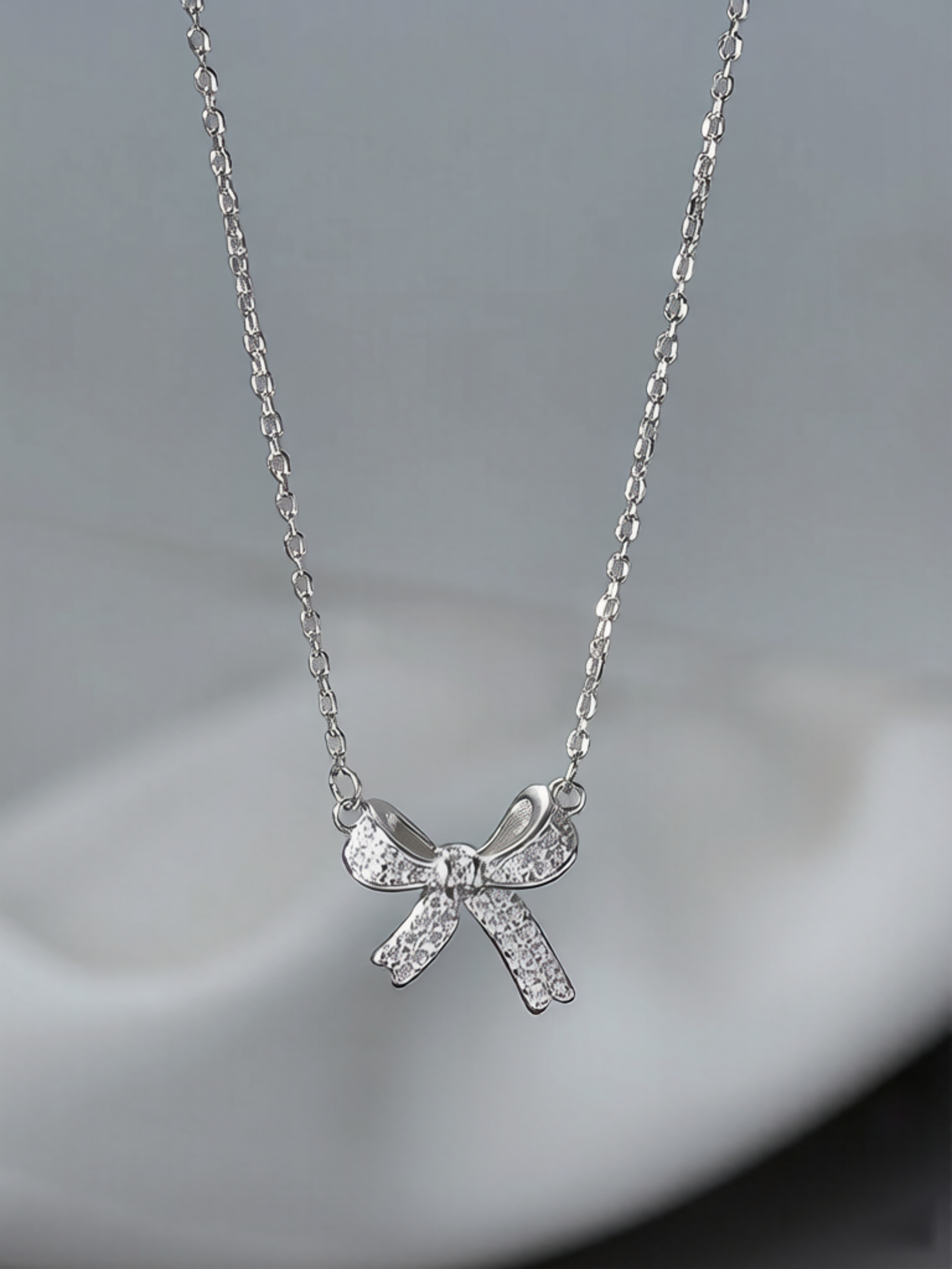 Silver Bow Pendant Necklace