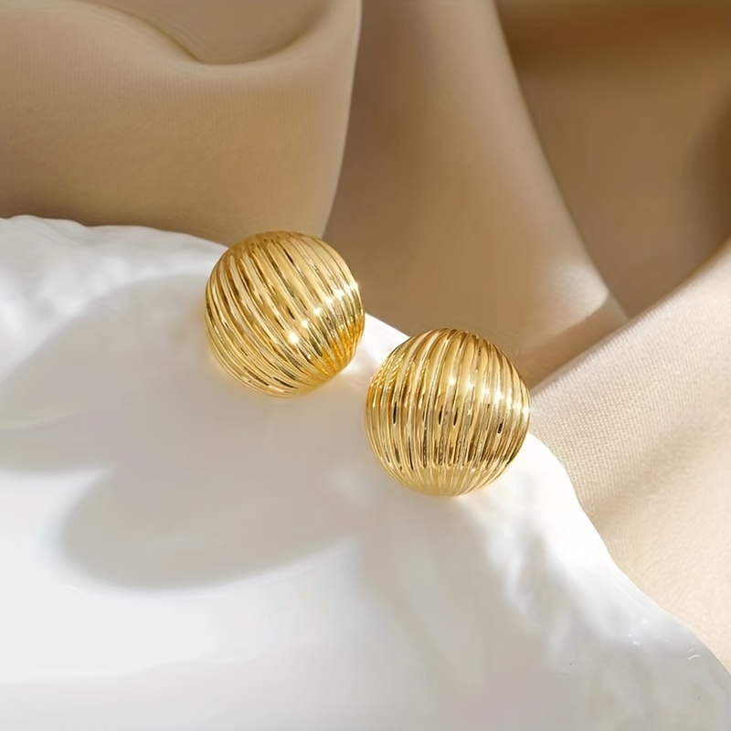 Gold Geometric Stud Earrings for Casual Wear.