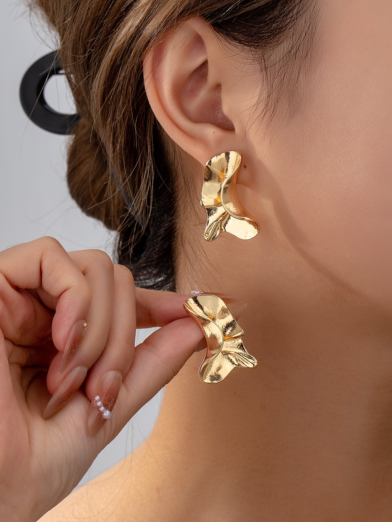 Gold Wavy Dangler Earrings for Casual Wear.