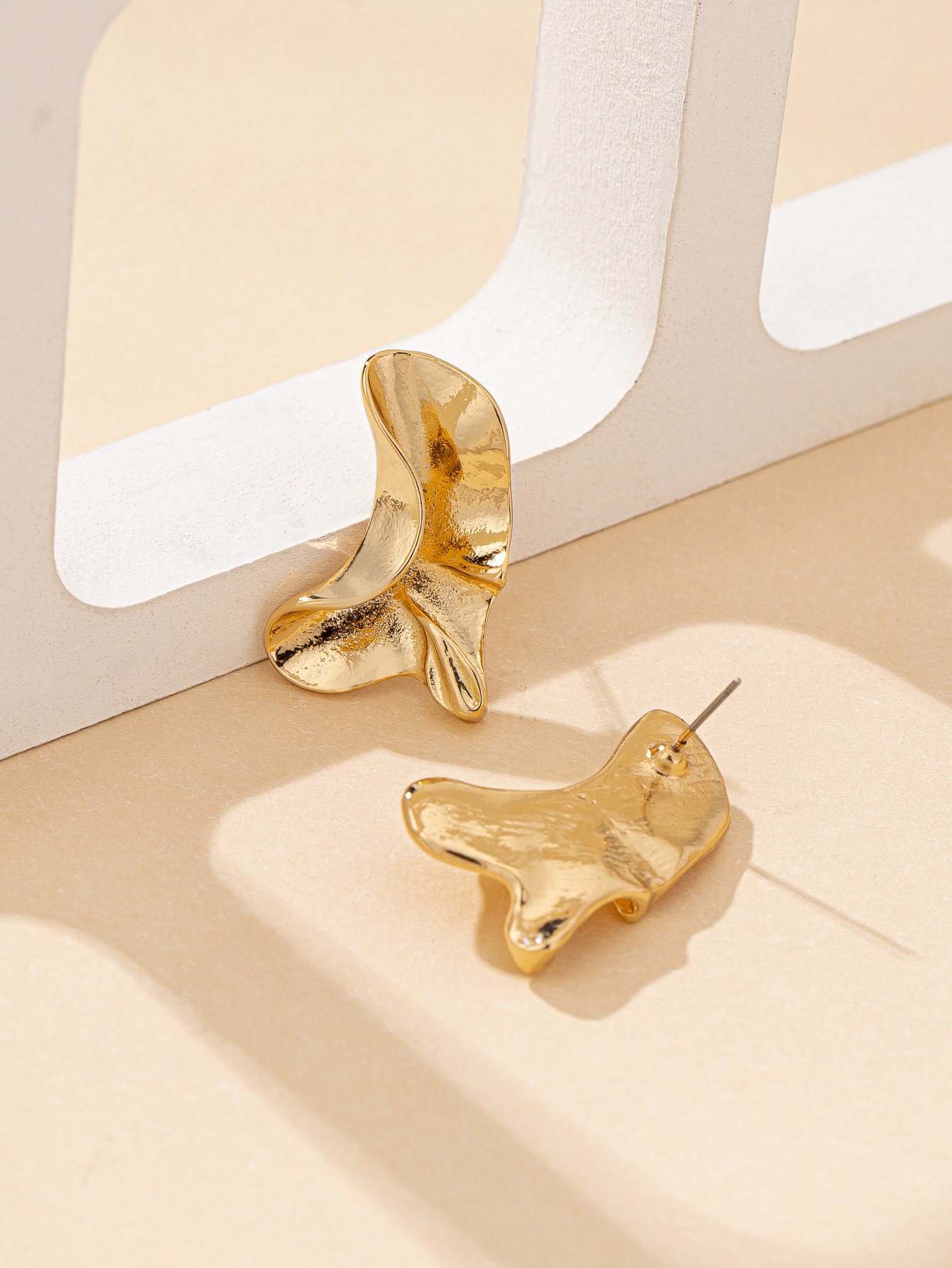 Gold Wavy Dangler Earrings for Casual Wear.