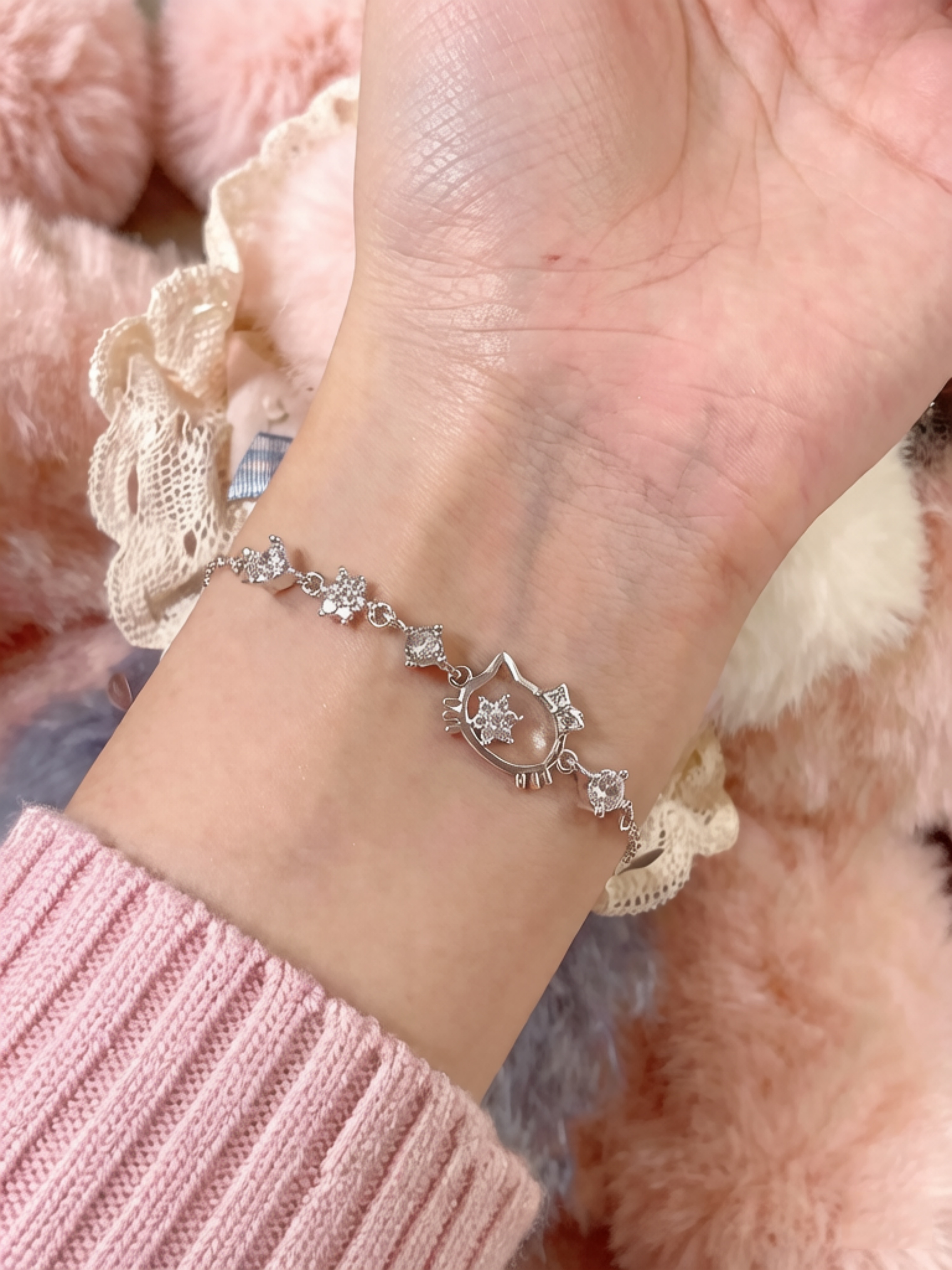 Sparkling Silver Charm Bracelet with Hello Kitty Design.