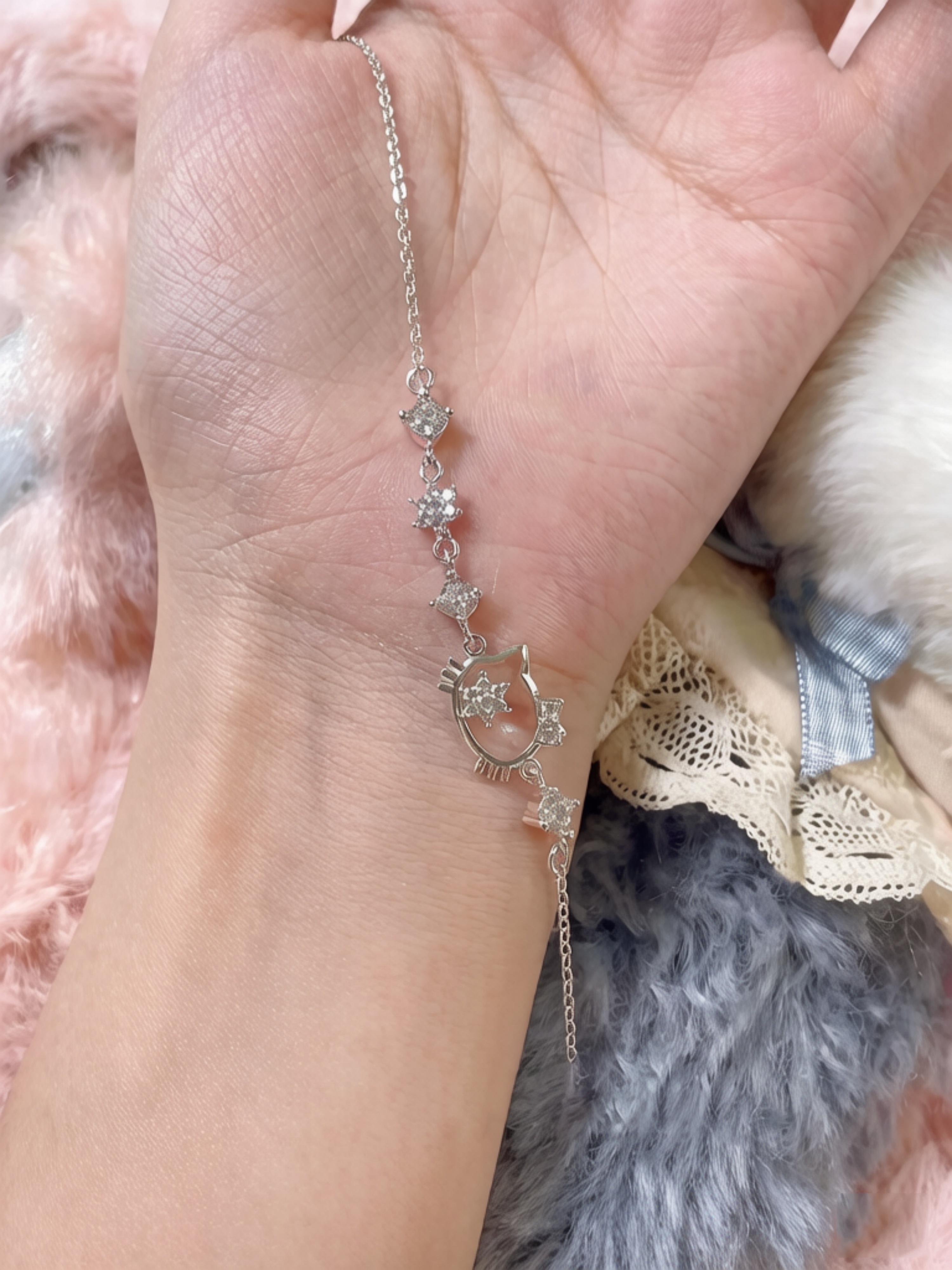 Sparkling Silver Charm Bracelet with Hello Kitty Design.