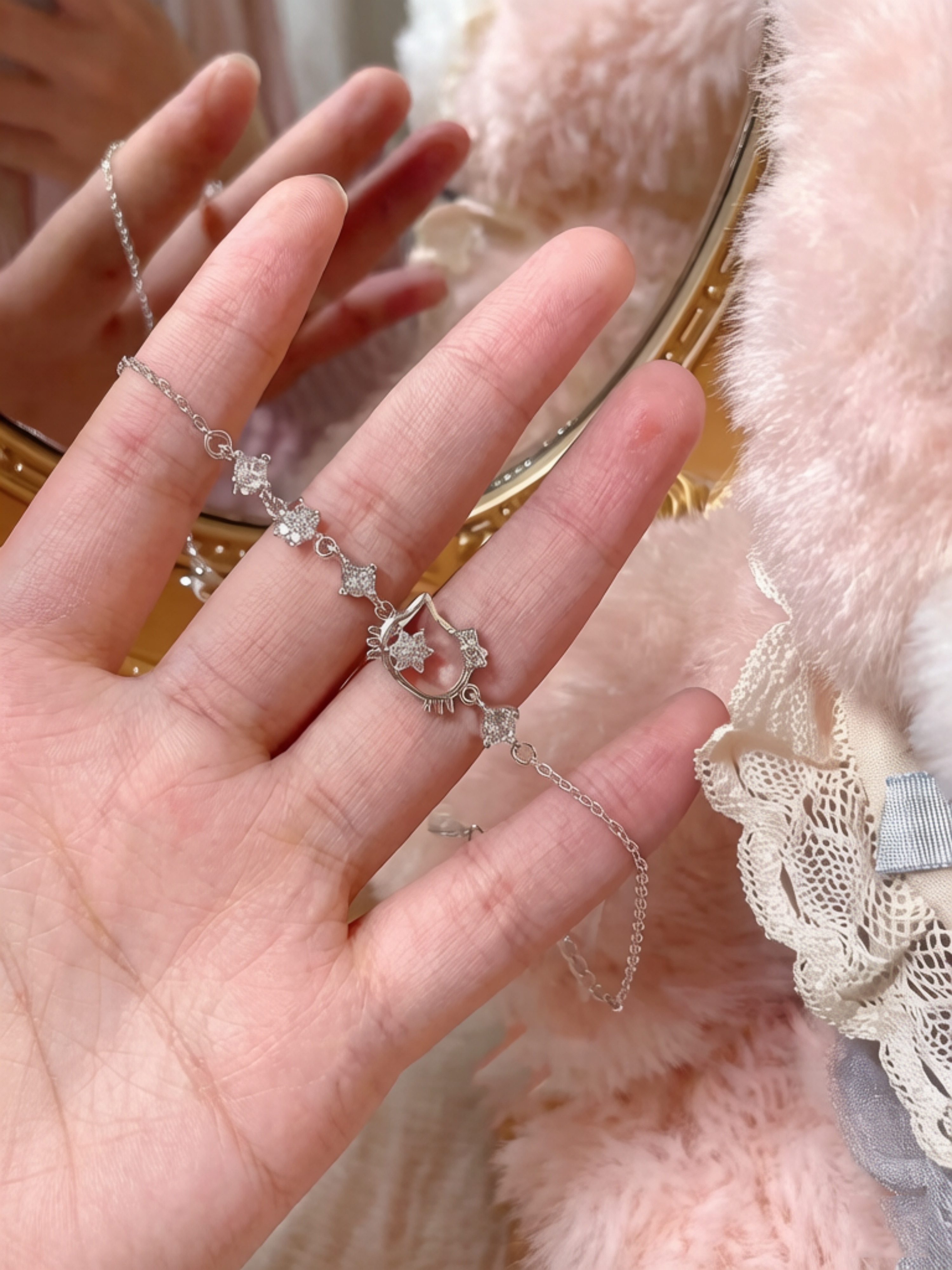 Sparkling Silver Charm Bracelet with Hello Kitty Design.