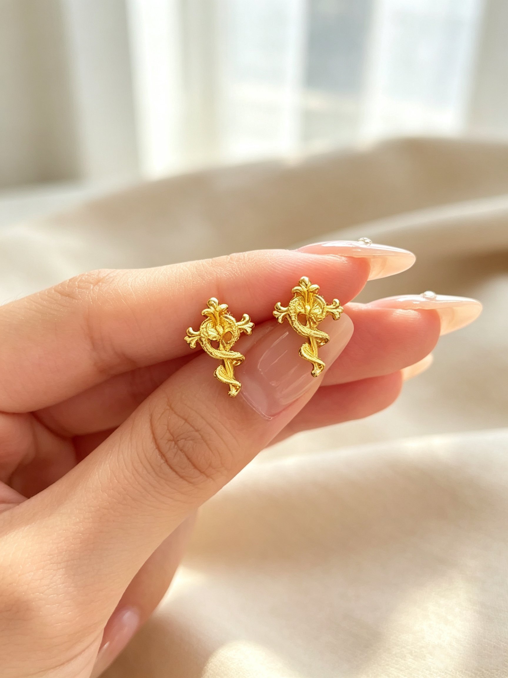 Gold Tone Serpent Cross Stud Earrings