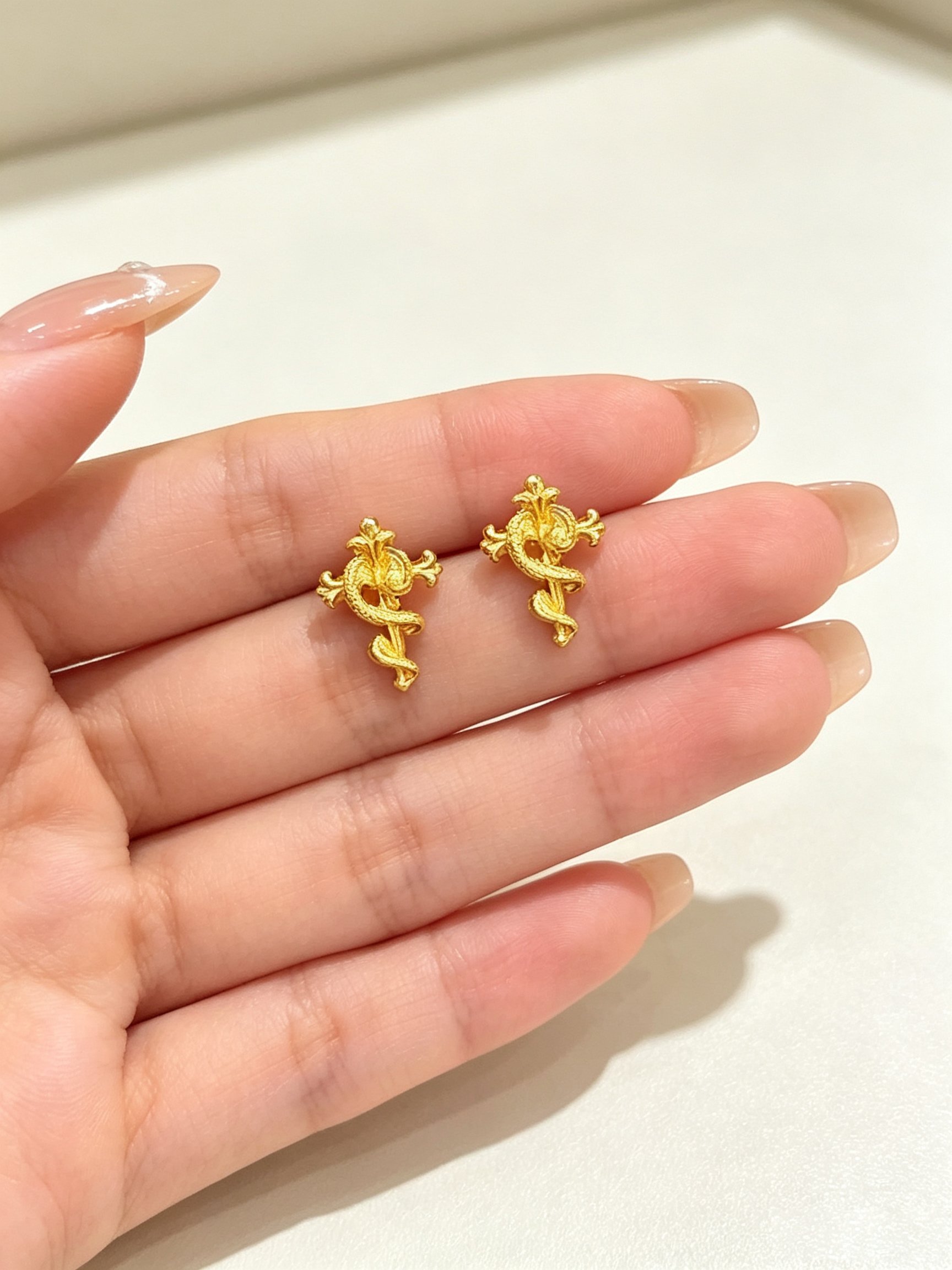 Gold Tone Serpent Cross Stud Earrings