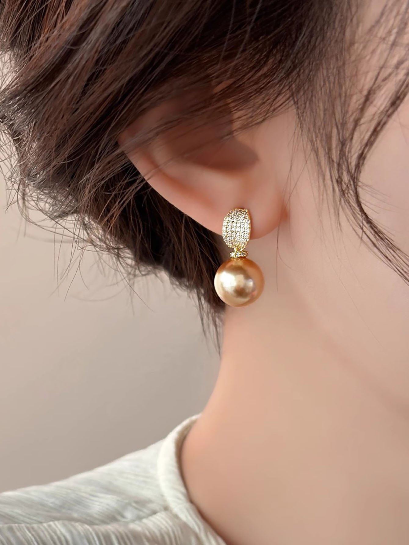 Golden Pearl Stud Earrings with Zircon Accent.