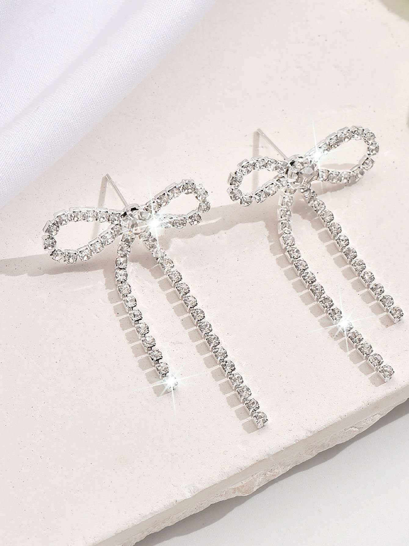 Silver Bow Stud Earrings with Dangle Chain.
