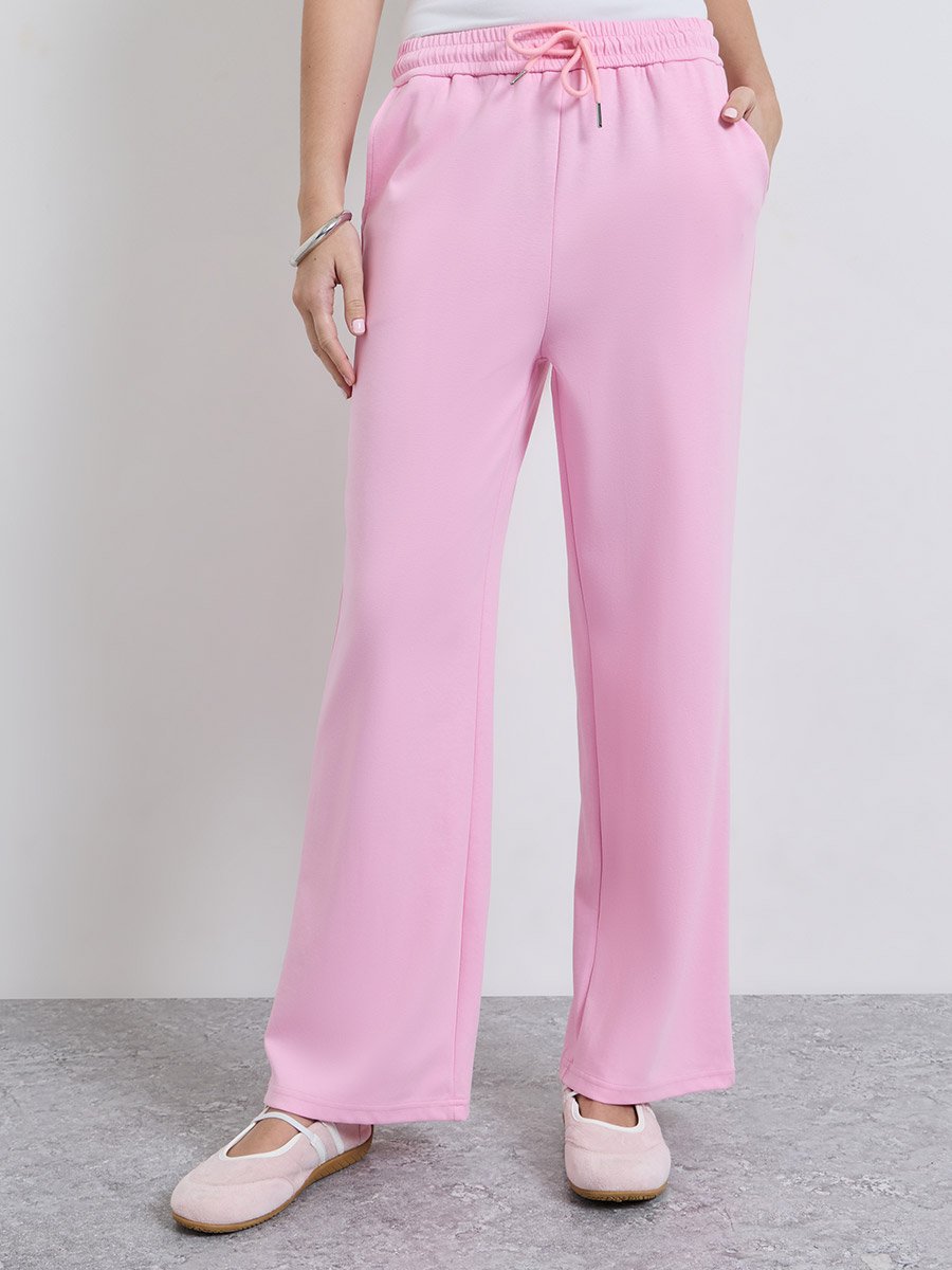جوغر بأرجل واسعة ورباط على الخصر وردي