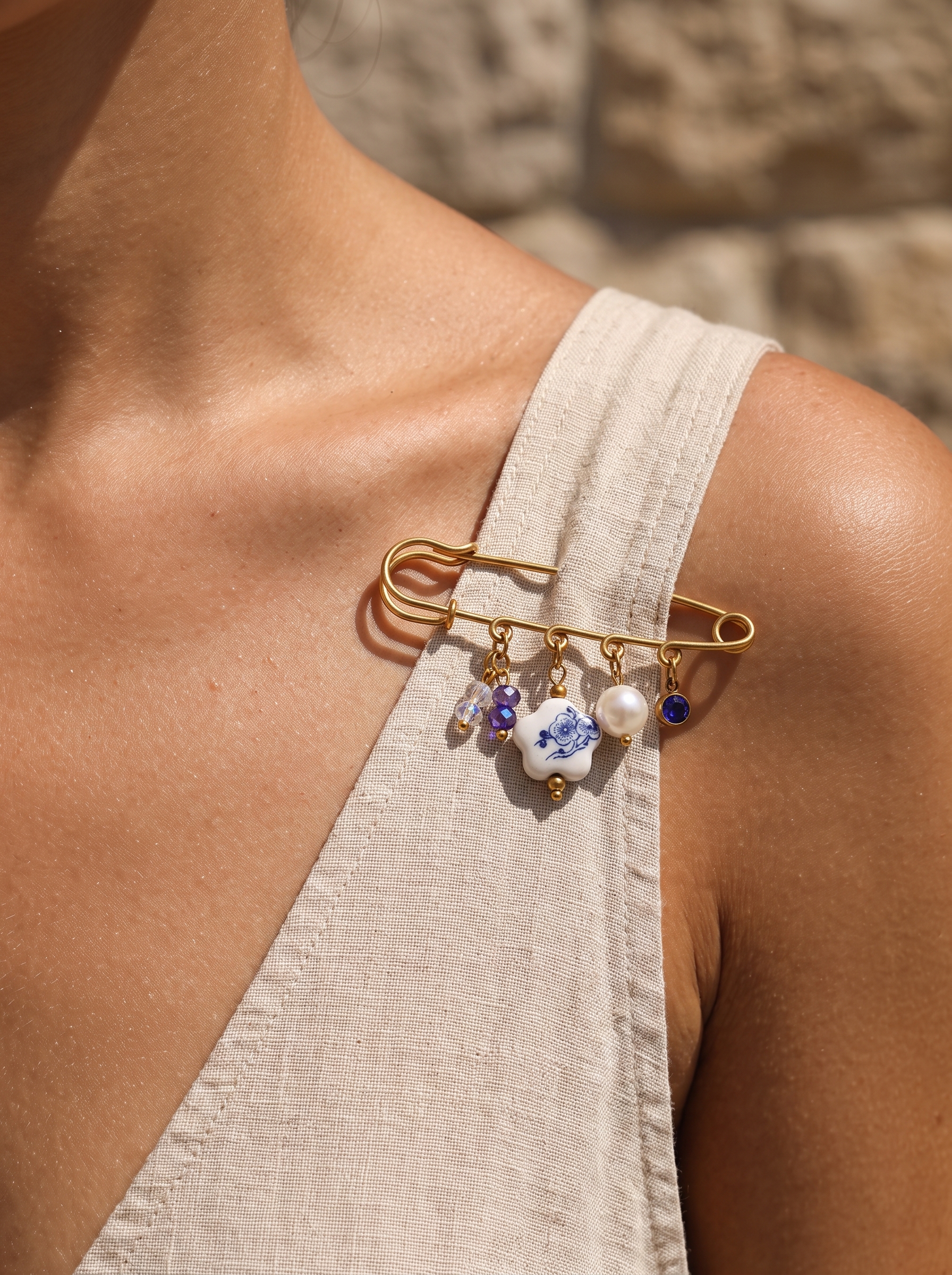 Elegant Gold Plated Brooch with Blue and White Porcelain Charm