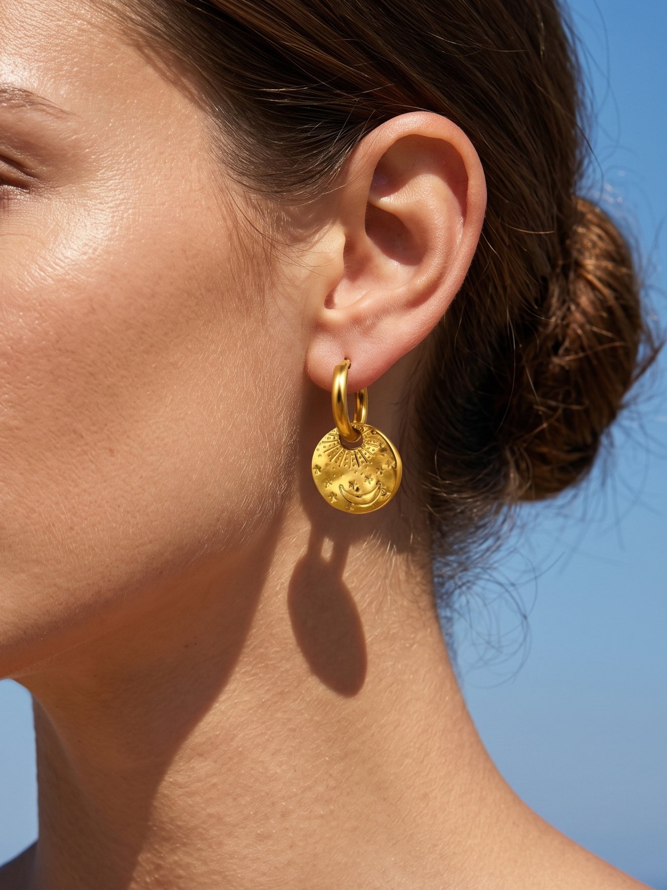 Gold Crescent Moon and Star Charm Hoop Earrings.