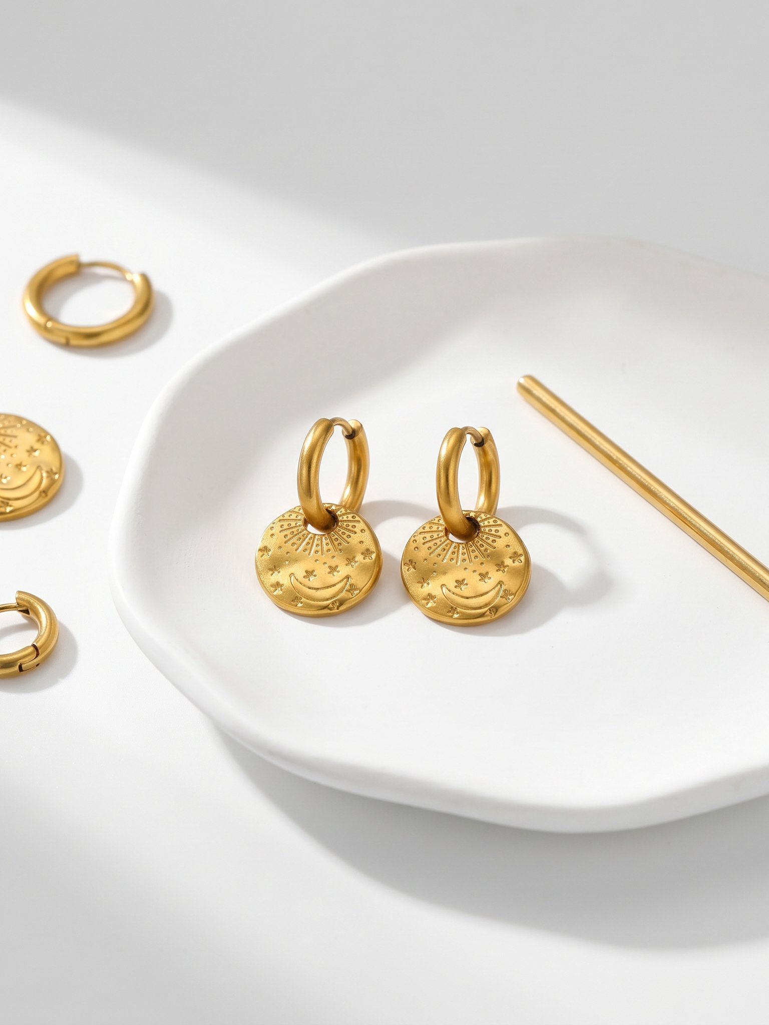 Gold Crescent Moon and Star Charm Hoop Earrings.