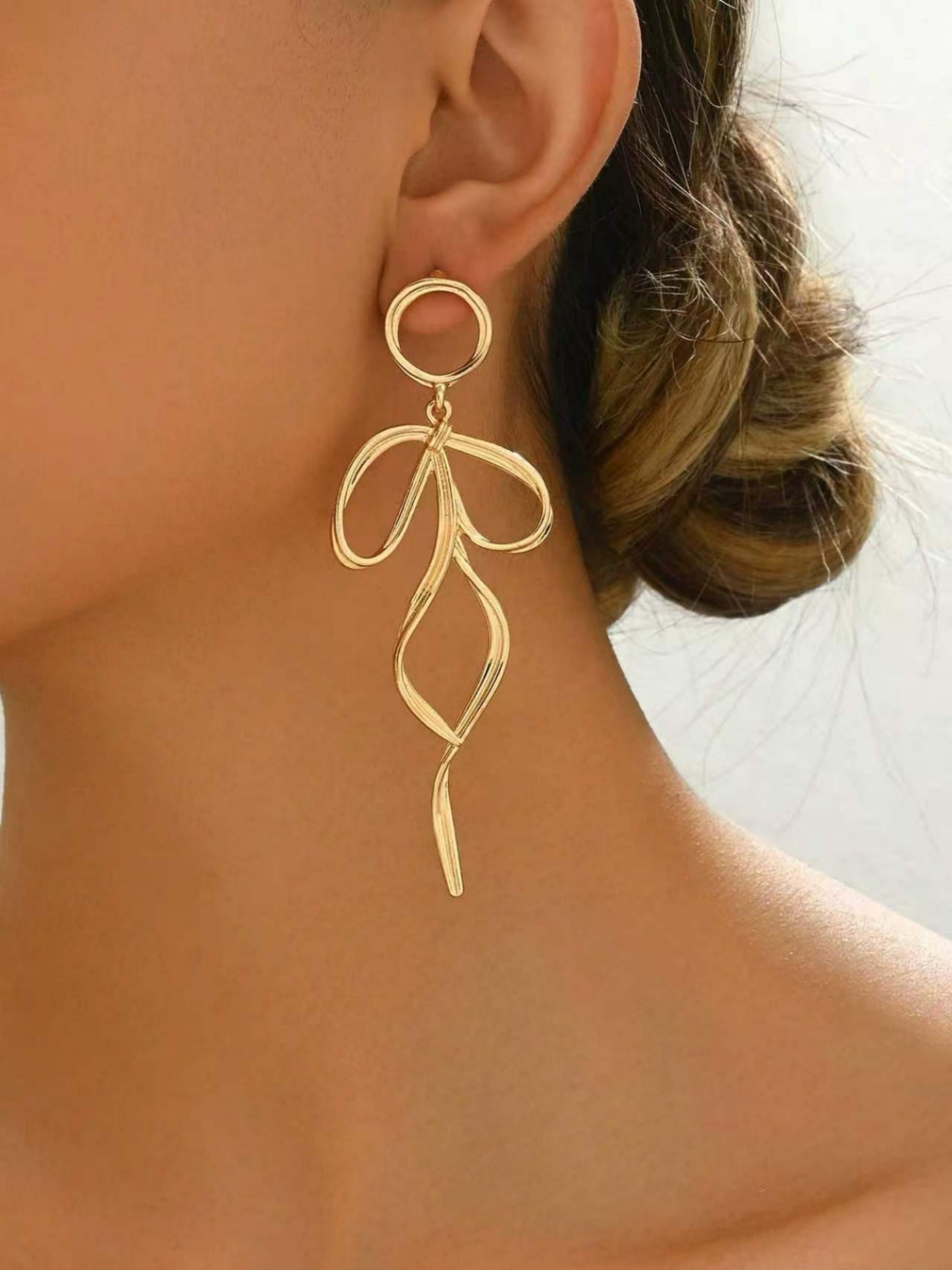 Gold Dangle Earrings with Bow Design