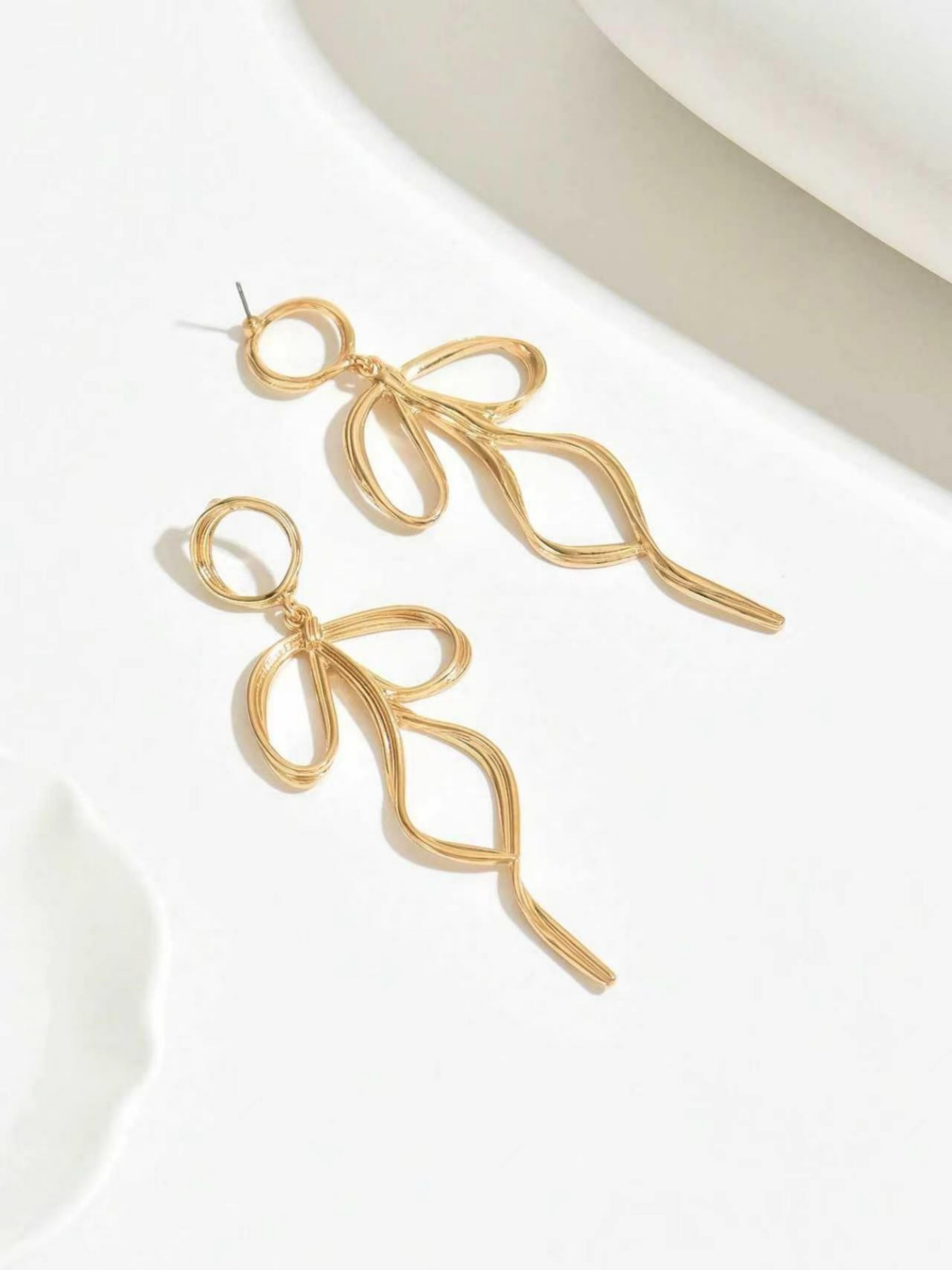 Gold Dangle Earrings with Bow Design
