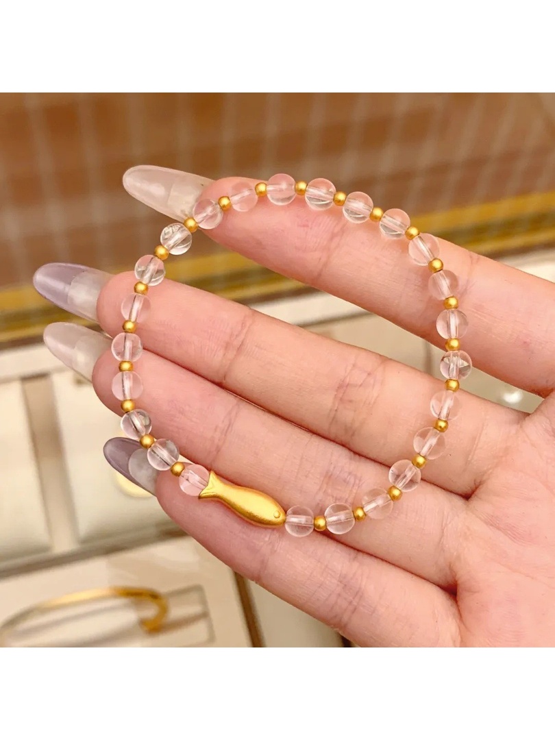 سوار مطاطي بدلاية سمكة باللون الذهبي