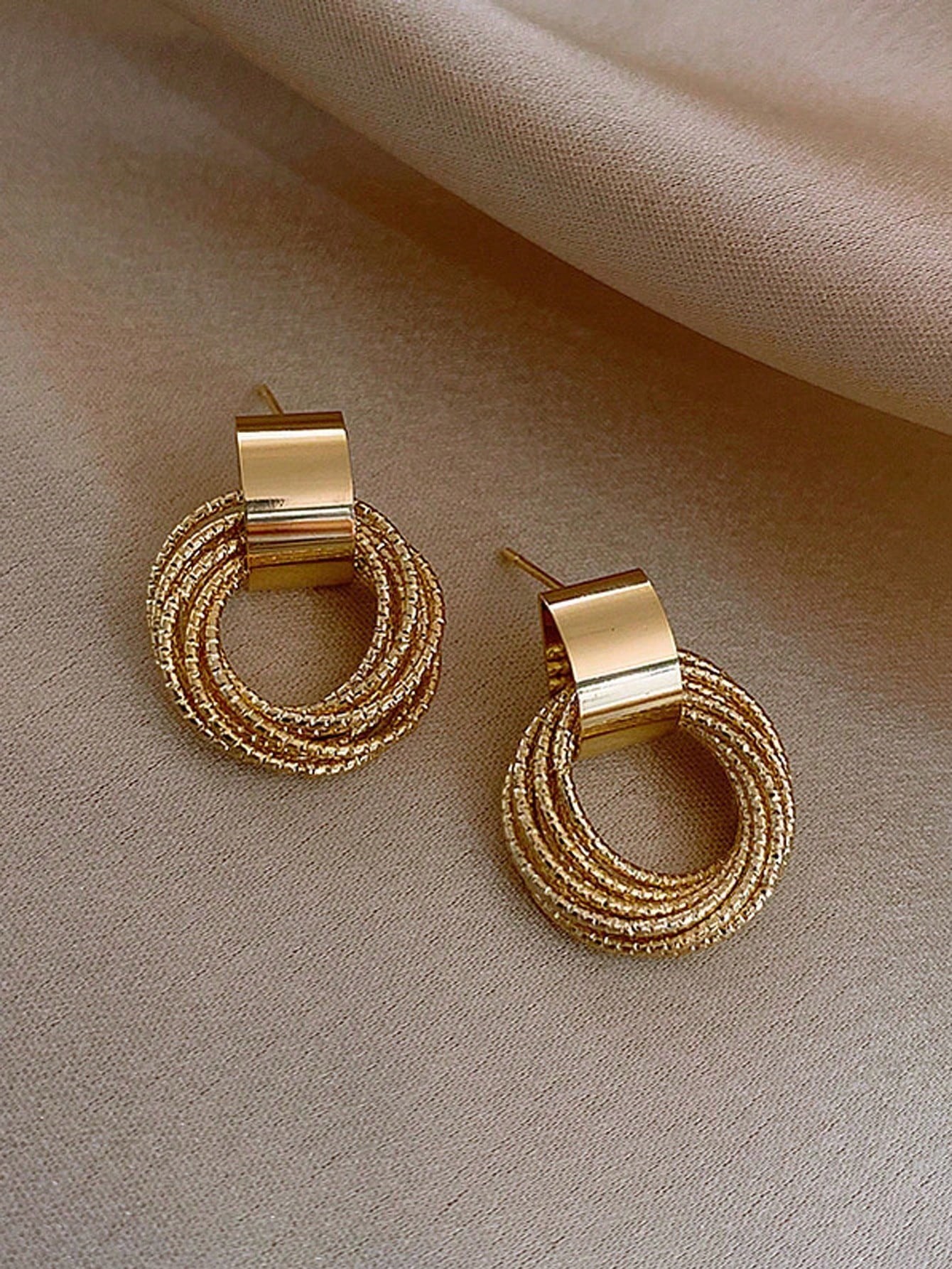 Gold Stud Earrings for Women - Casual Wear Twisted Circle Design.