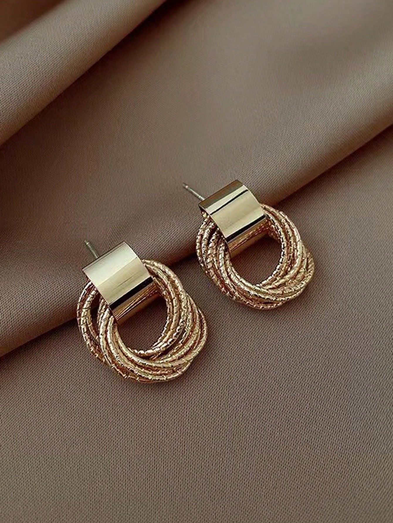 Gold Stud Earrings for Women - Casual Wear Twisted Circle Design.