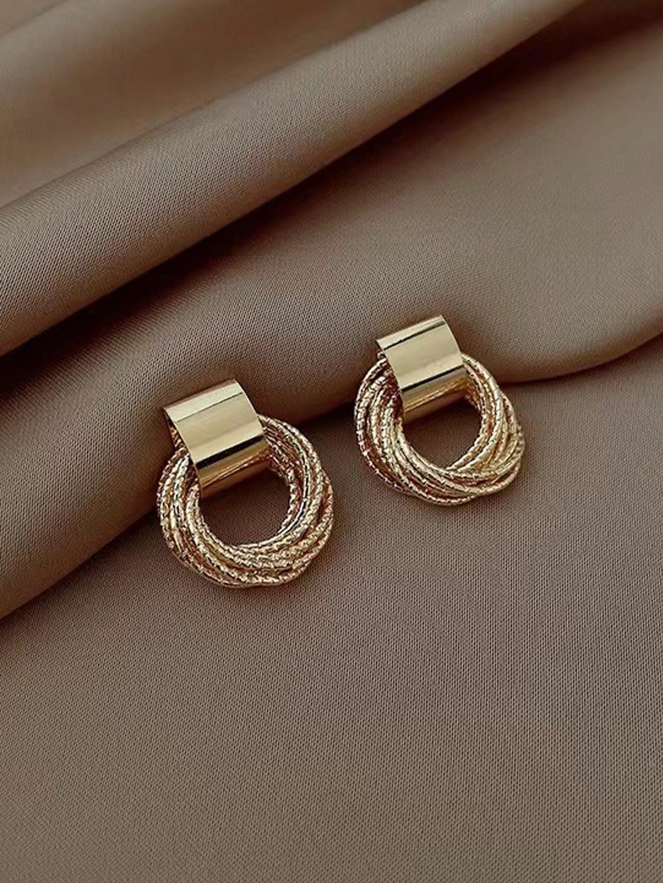 Gold Stud Earrings for Women - Casual Wear Twisted Circle Design.