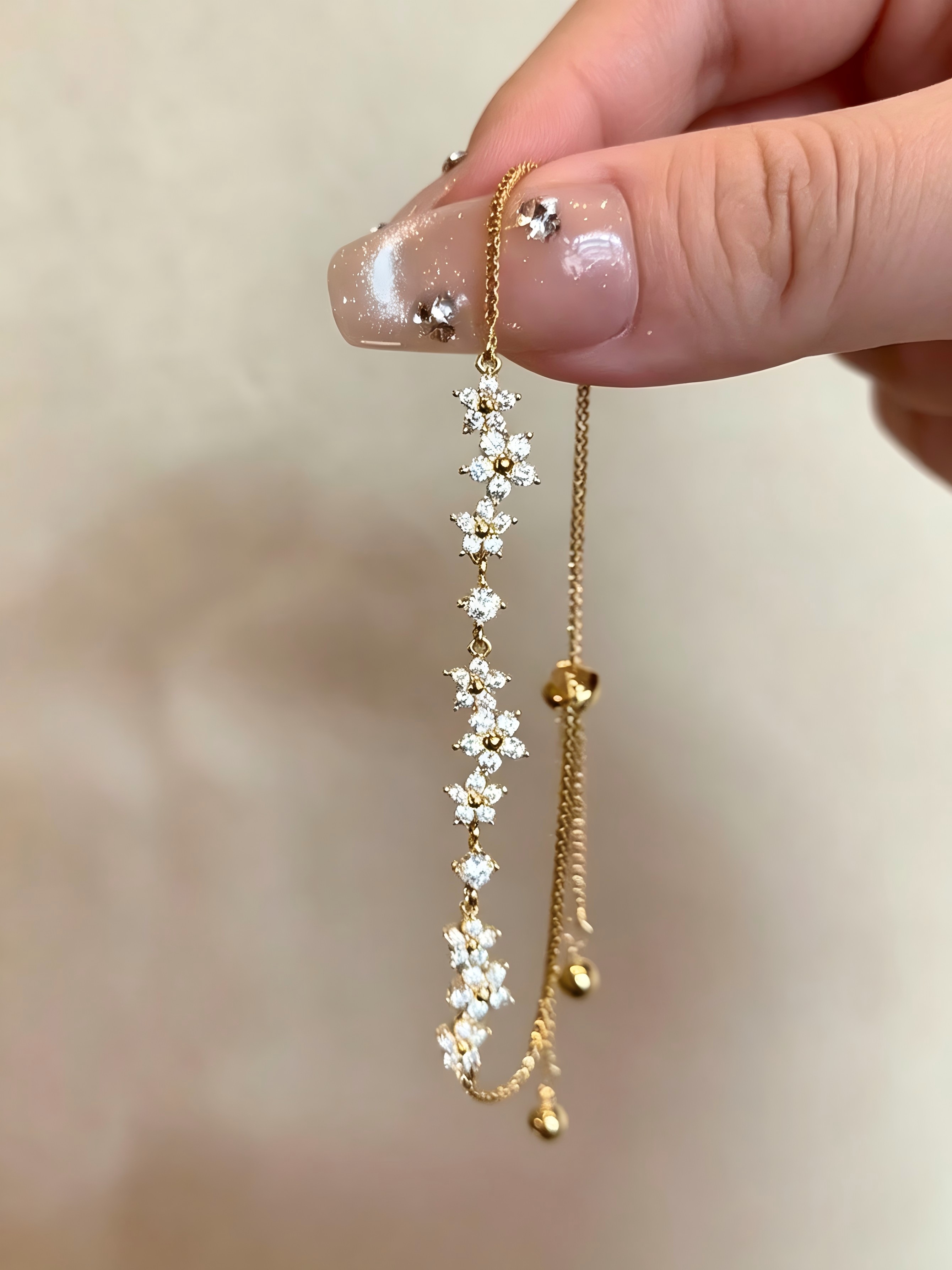 Gold Flower Charm Bracelet - Adjustable and Sparkling Daily Wear.