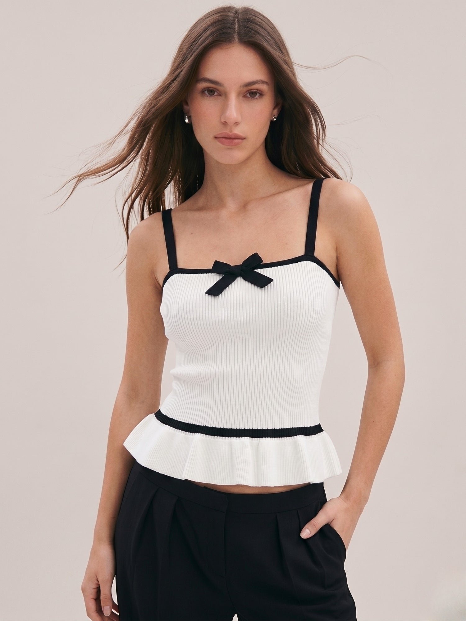 White Sleeveless Peplum Top with Contrast Bow