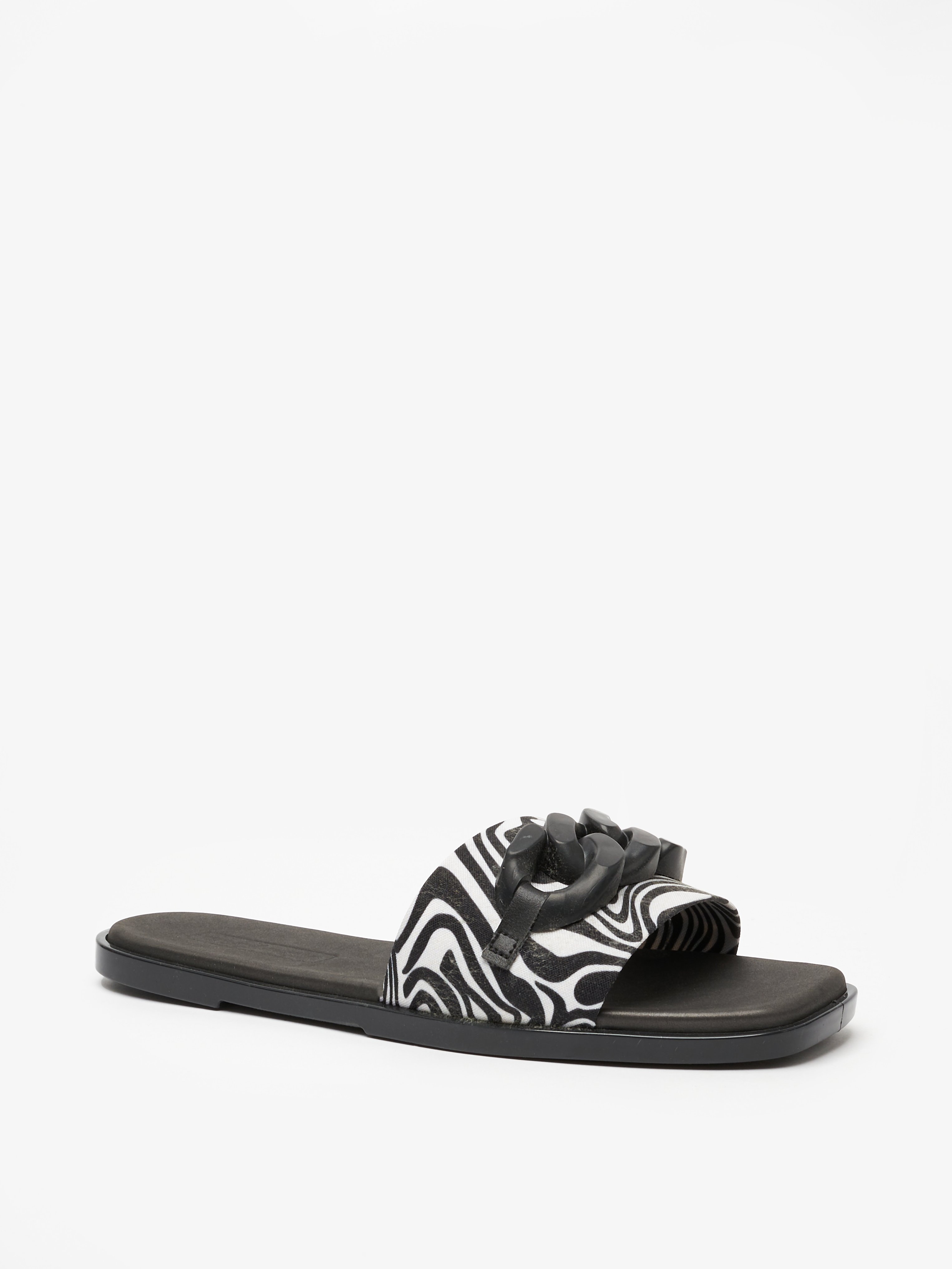 Black Kaydence Printed Flat Sandals with Chain Trim