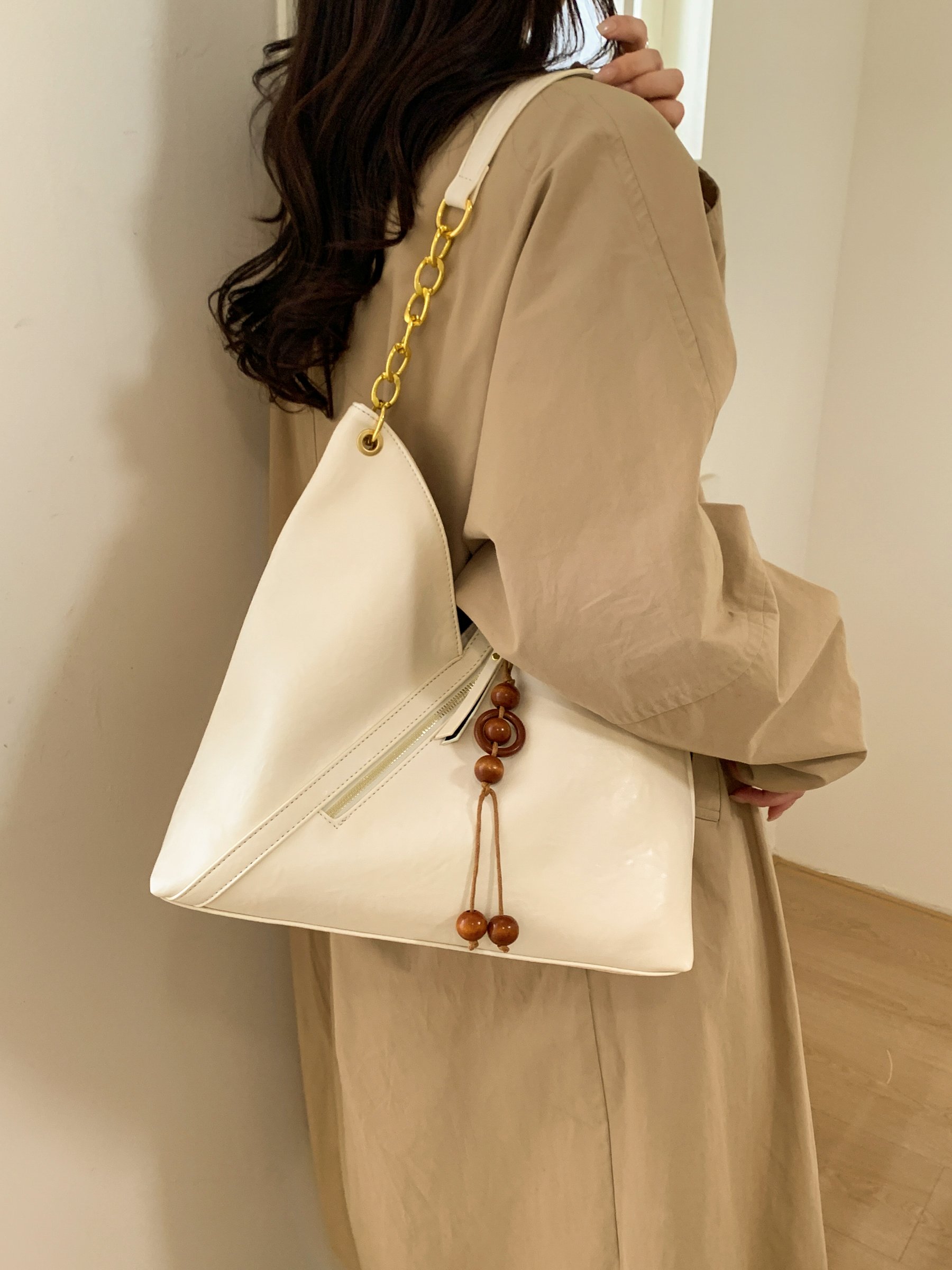 Beige Shoulder Bag with Gold Chain and Tassel Detail