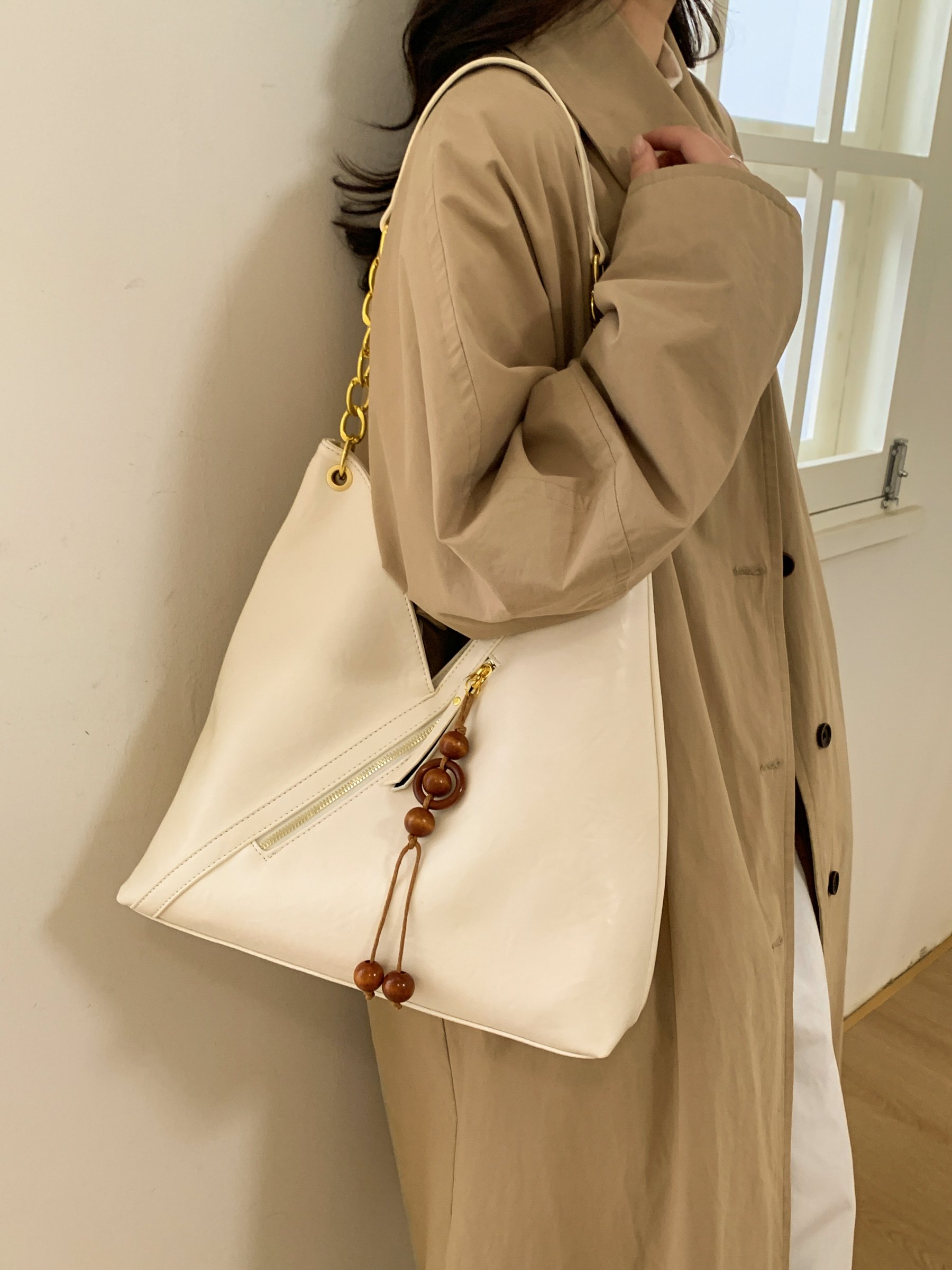 Beige Shoulder Bag with Gold Chain and Tassel Detail