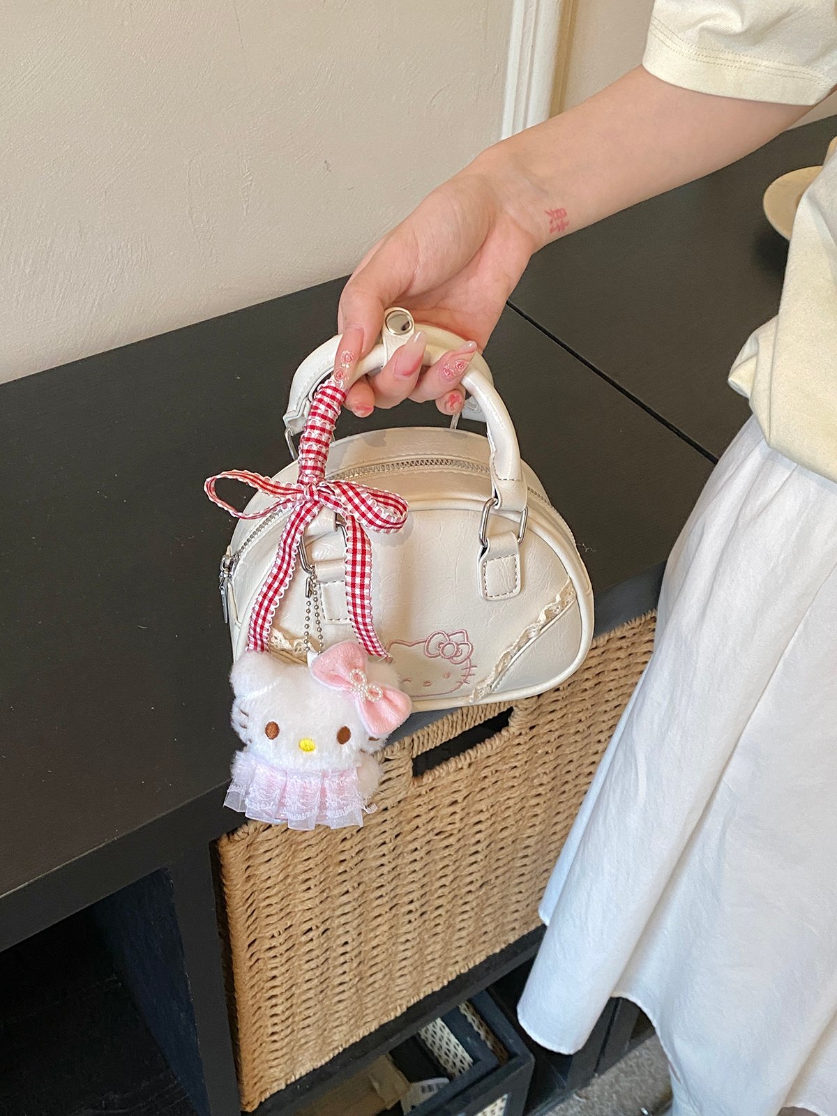 Off-White Handbag with Decorative Ribbon and Charm