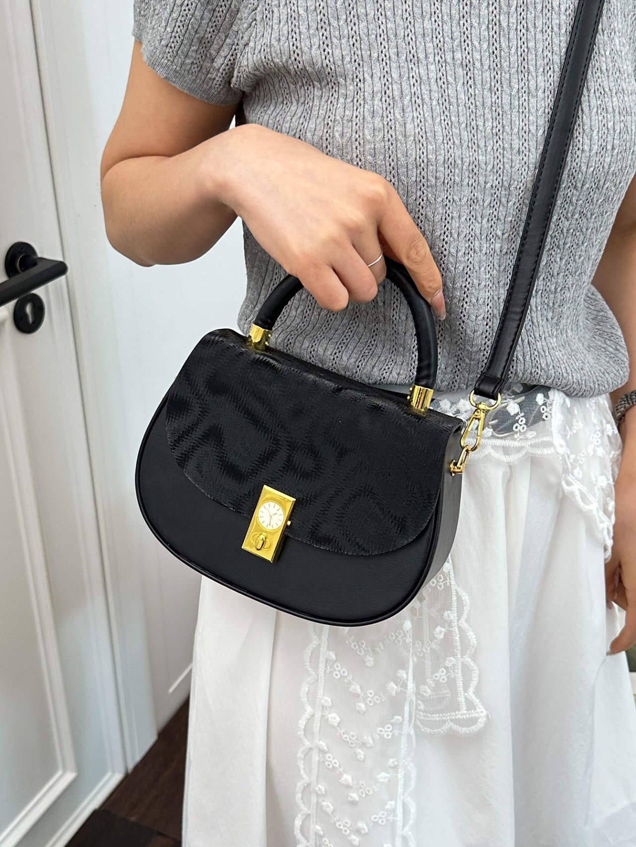 Black Crossbody Bag with Top Handle and Clock Detail