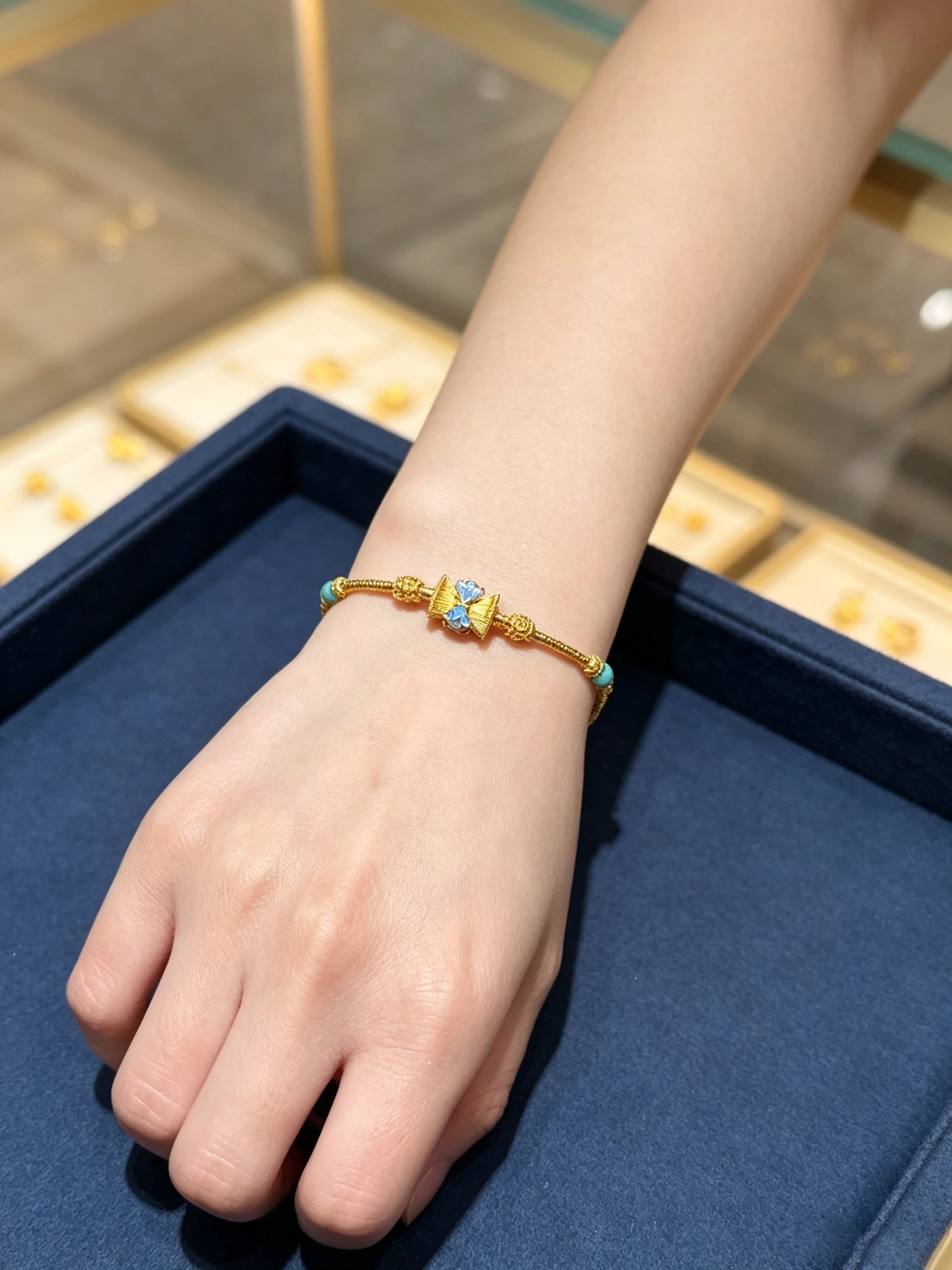 Golden Charm Bracelet with Blue Enamel and Turquoise Accent