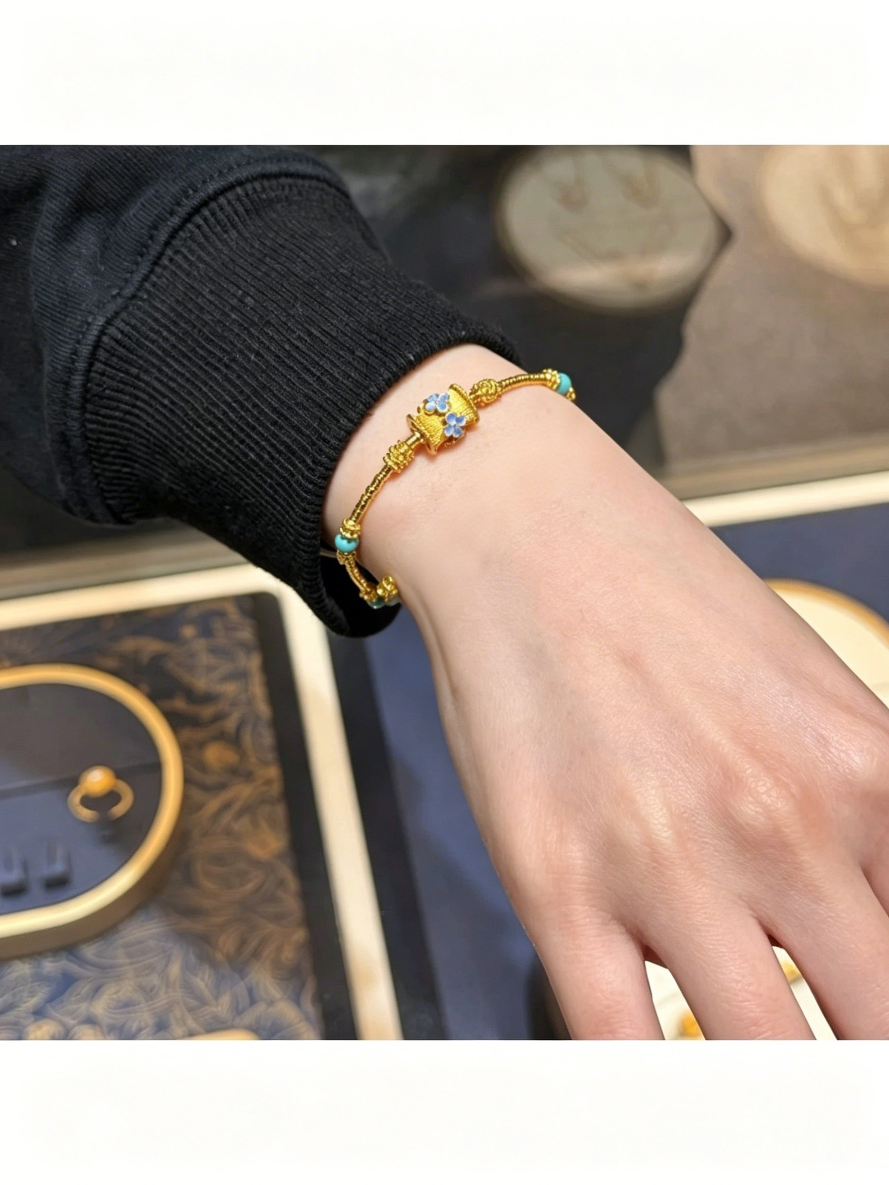 Golden Charm Bracelet with Blue Enamel and Turquoise Accent