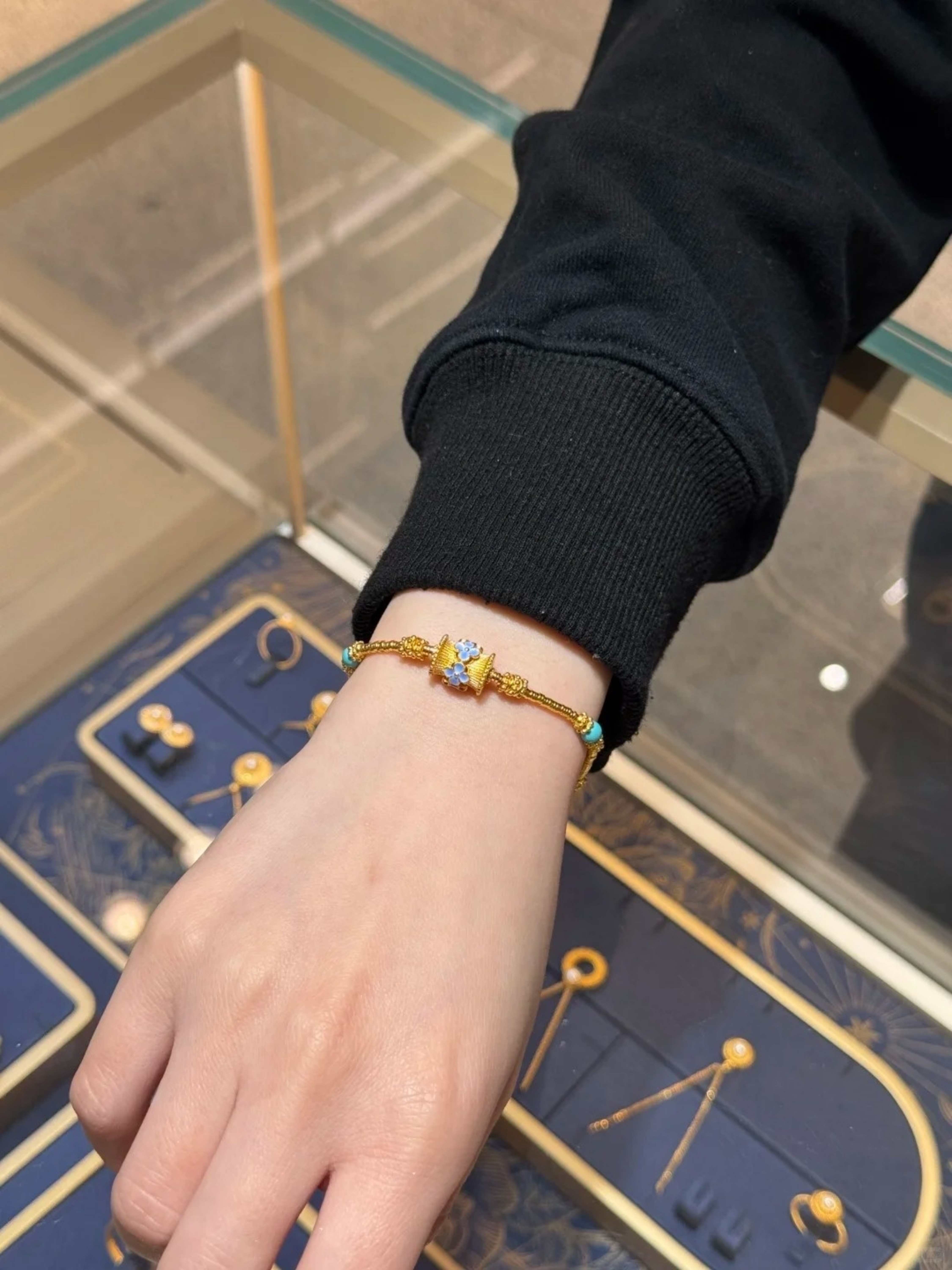 Golden Charm Bracelet with Blue Enamel and Turquoise Accent