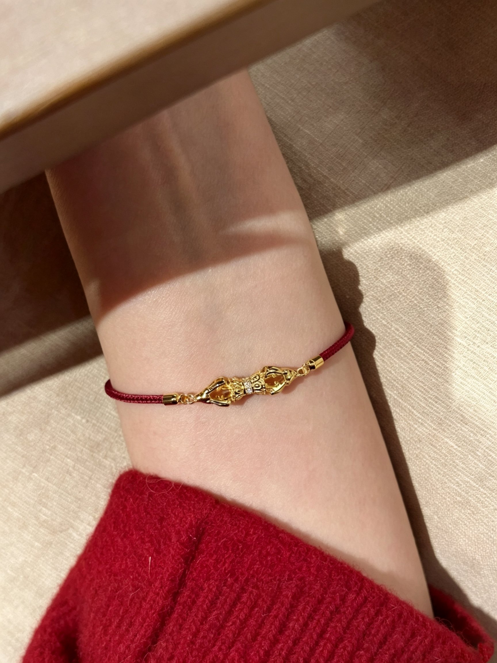 Gold Bracelet with Red Rope