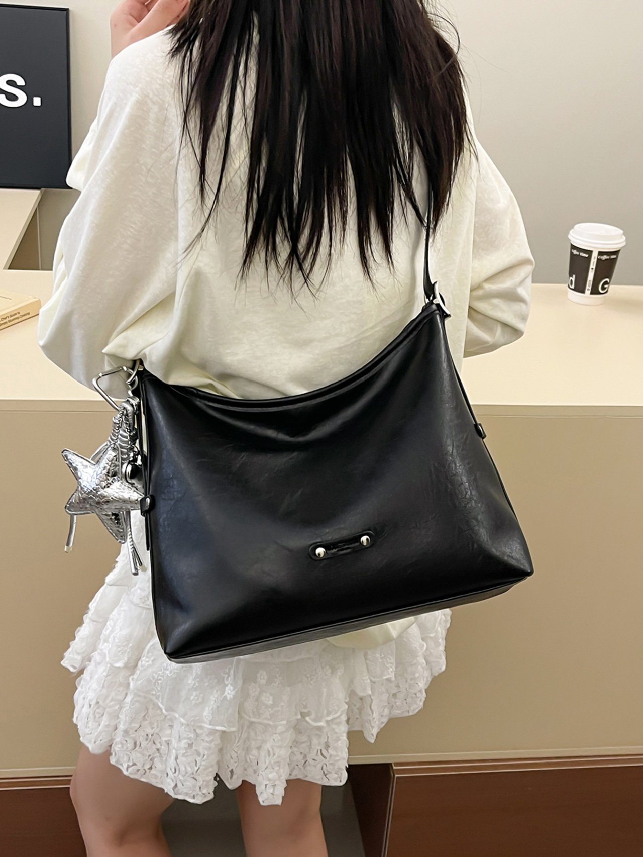 Black Crossbody Bag with Charm Detail