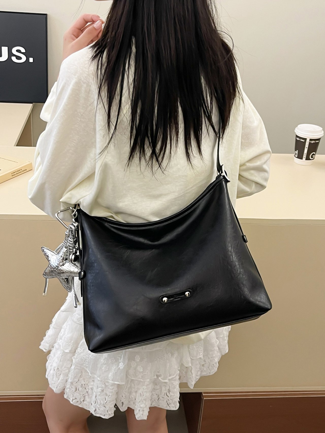 Black Crossbody Bag with Charm Detail