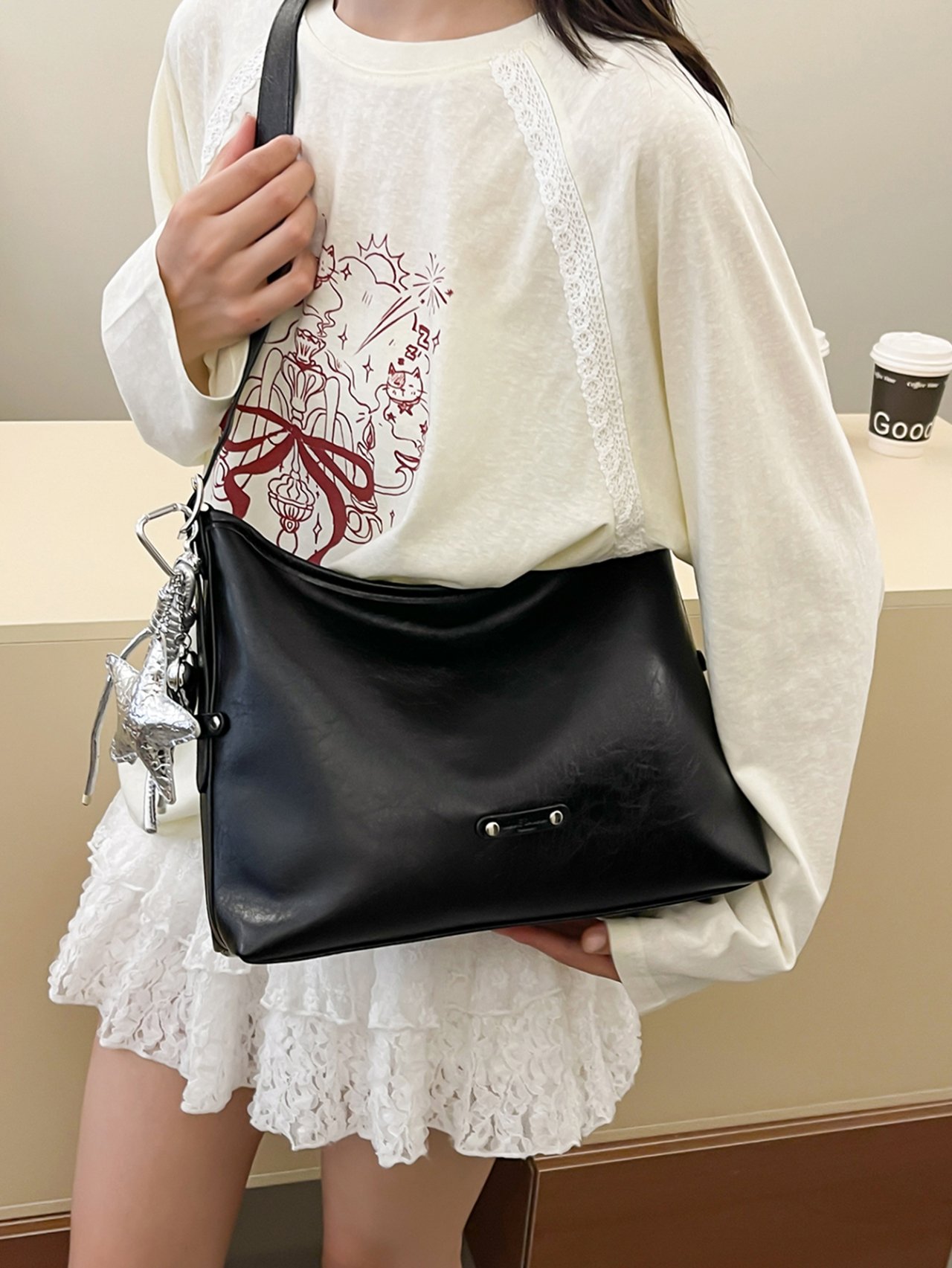 Black Crossbody Bag with Charm Detail