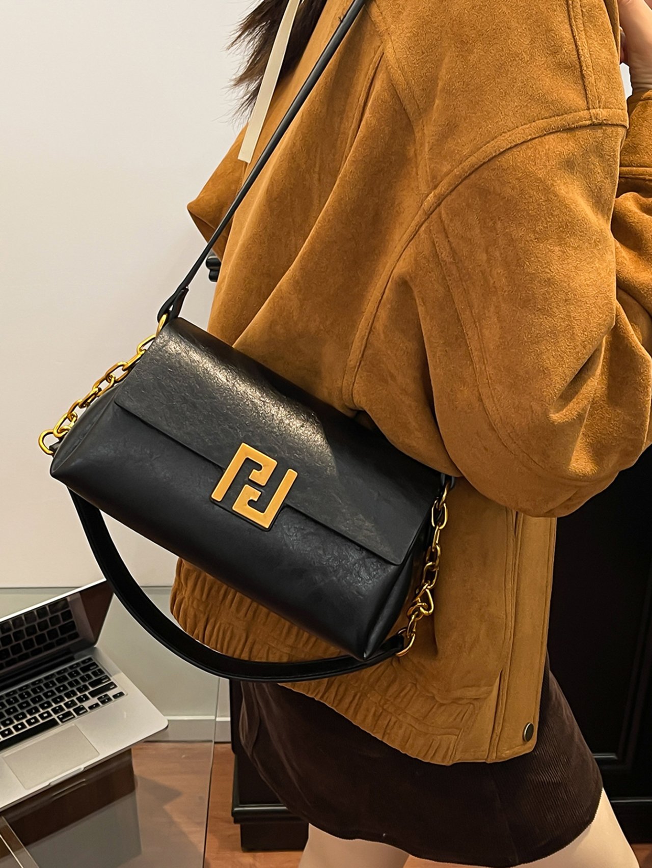 Black Crossbody Bag with Gold Chain Detail