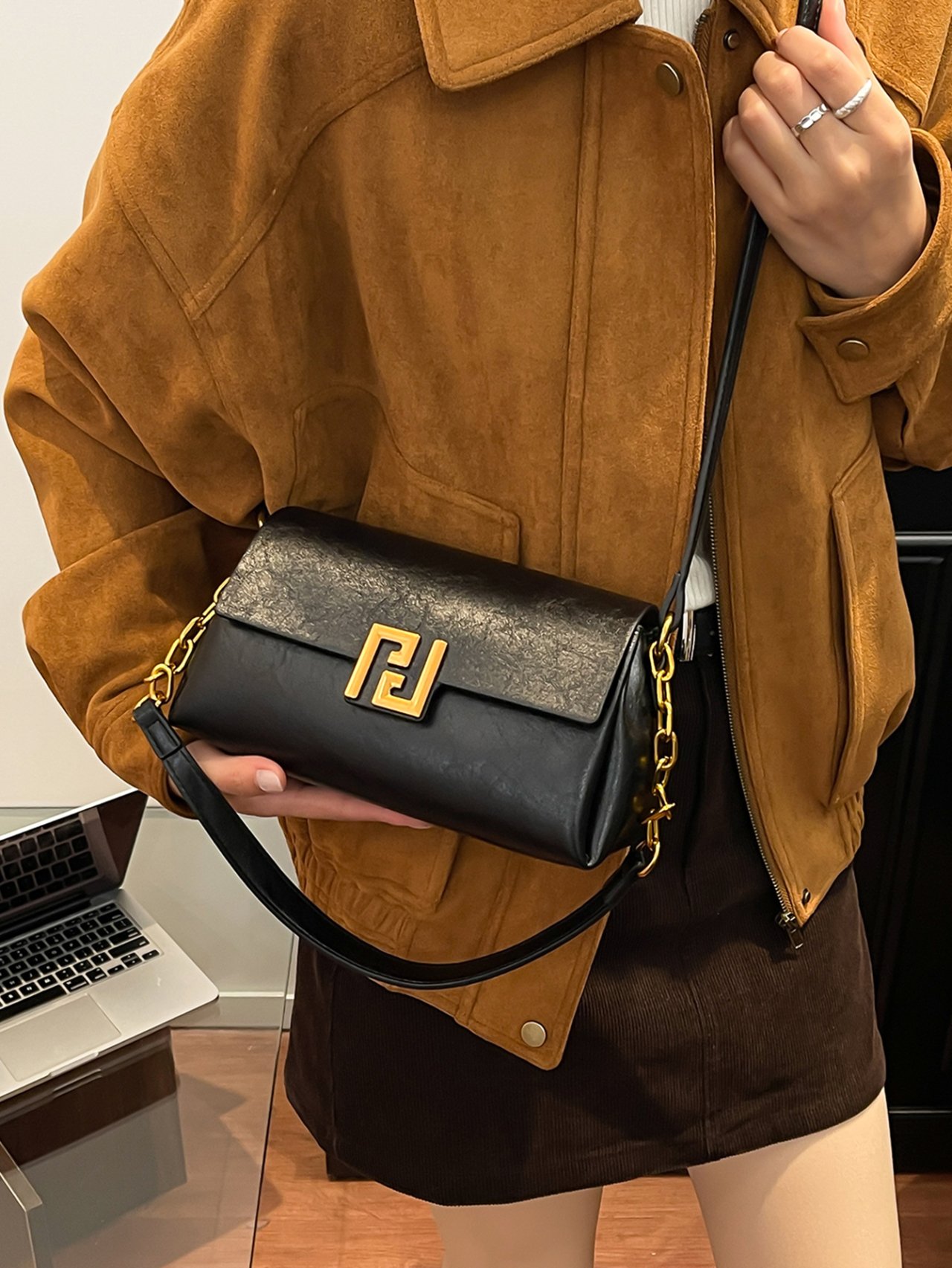 Black Crossbody Bag with Gold Chain Detail