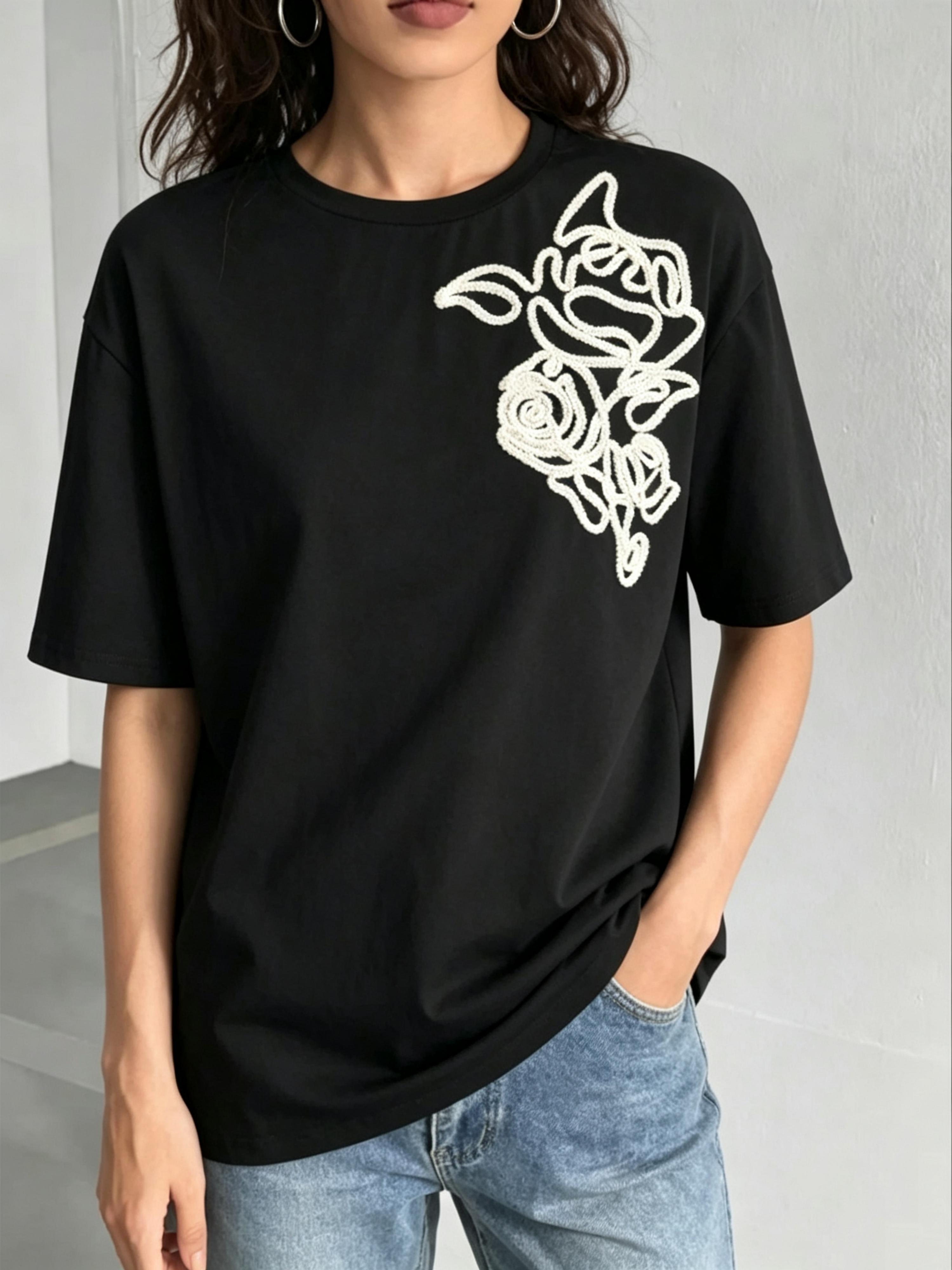 Black Knitted T-Shirt with Embroidered Floral Design