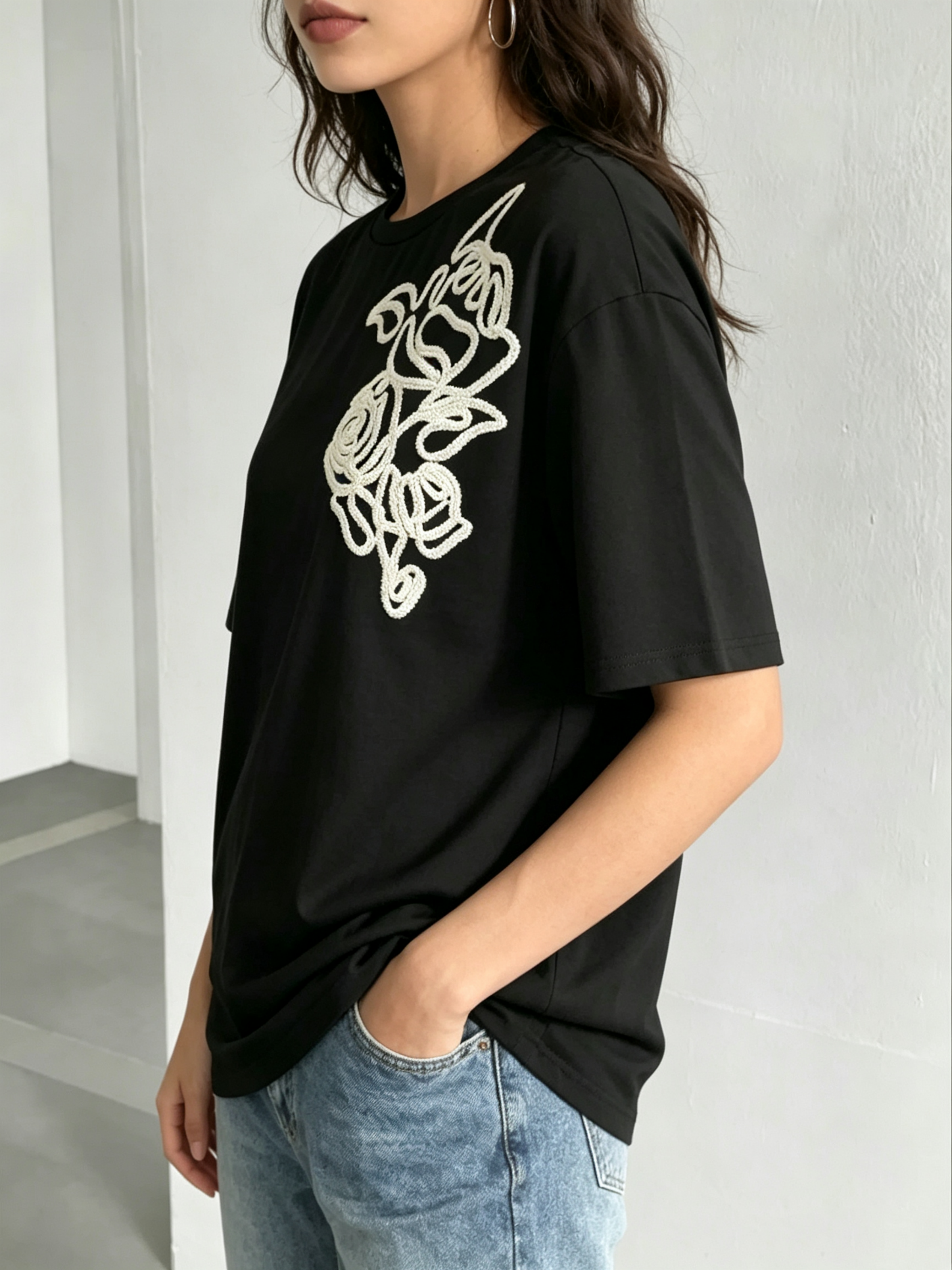 Black Knitted T-Shirt with Embroidered Floral Design