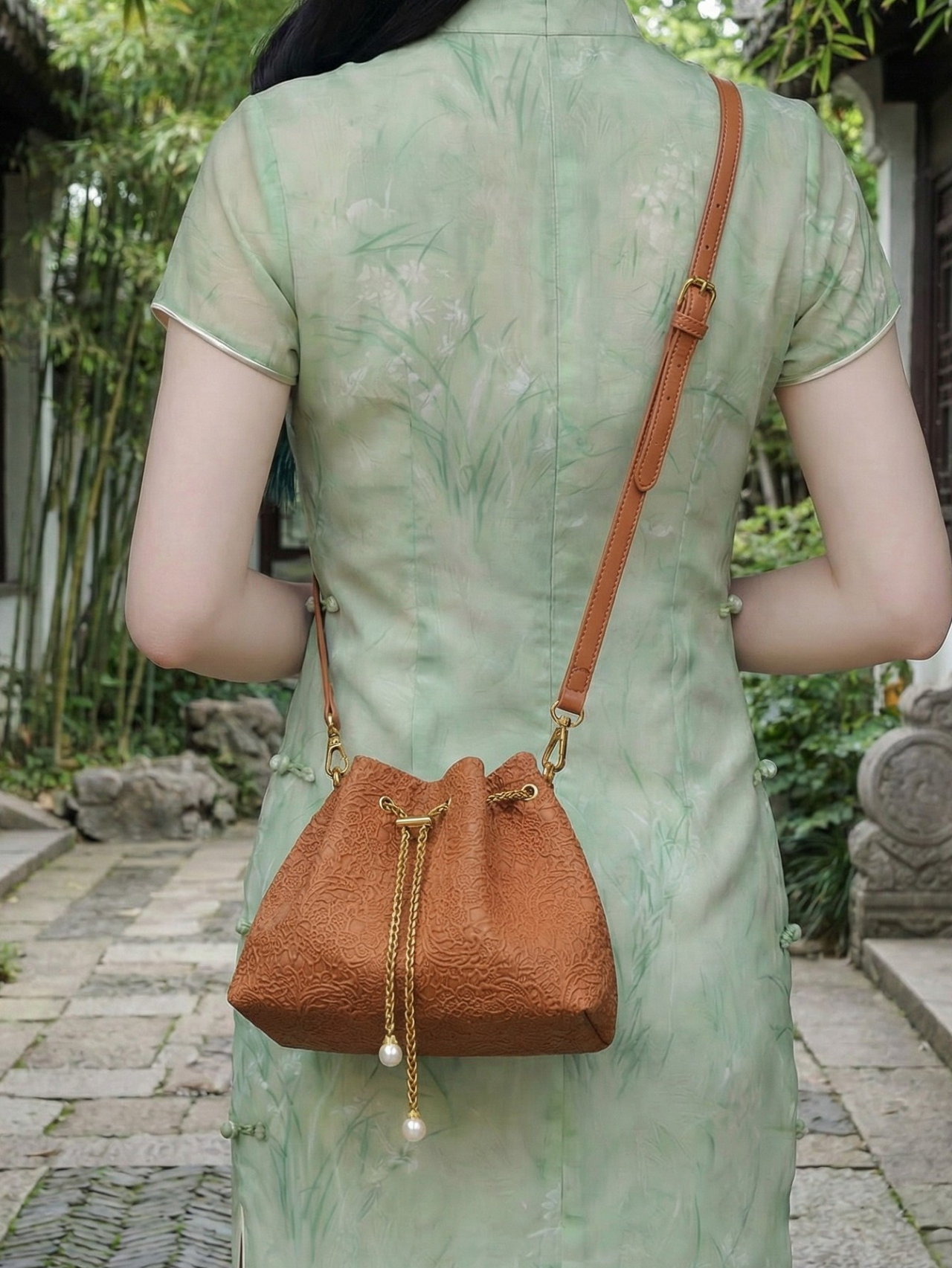 Rust Embossed Drawstring Crossbody Bag
