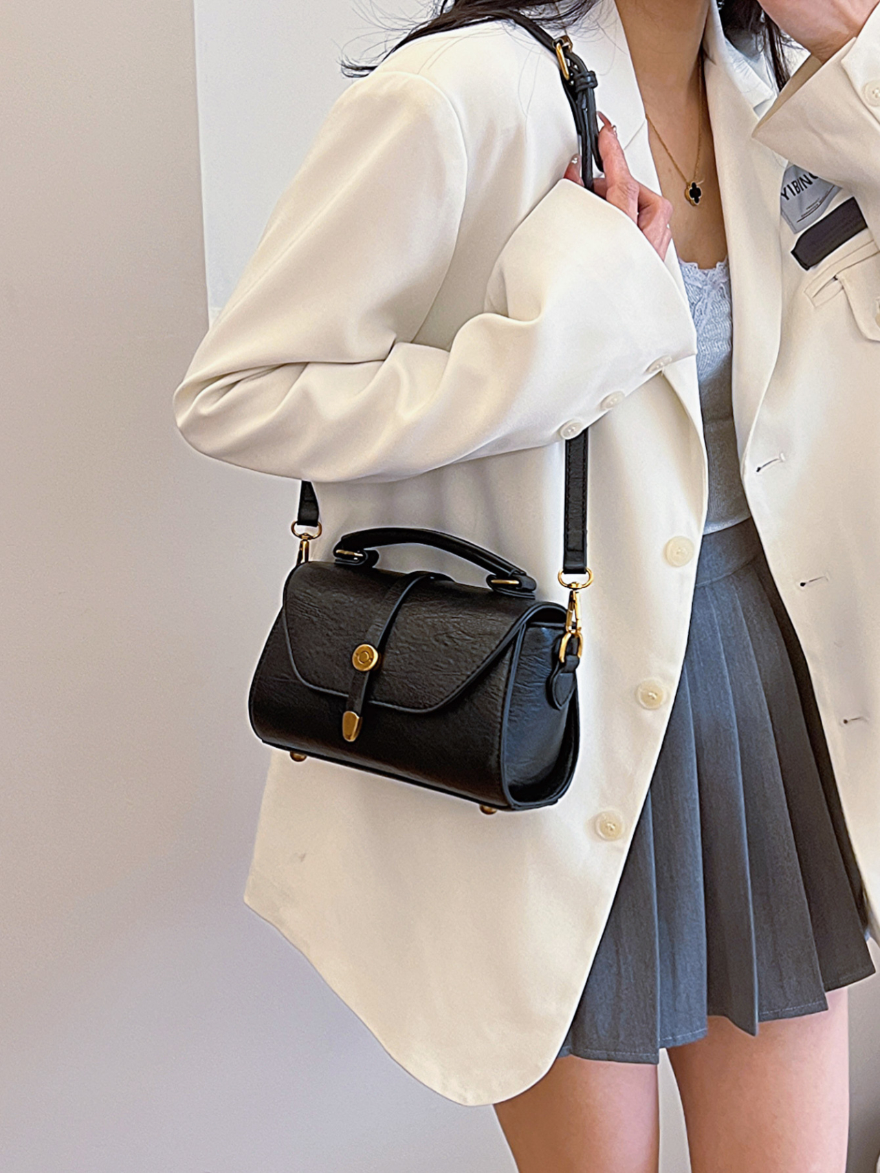 Black Crossbody Bag with Gold Accents