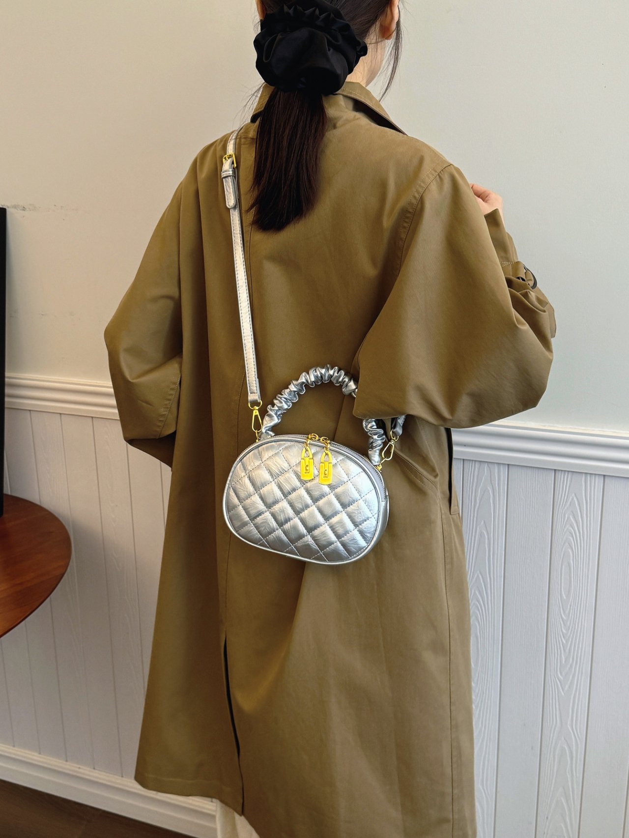 Silver Quilted Crossbody Bag with Gold Accents