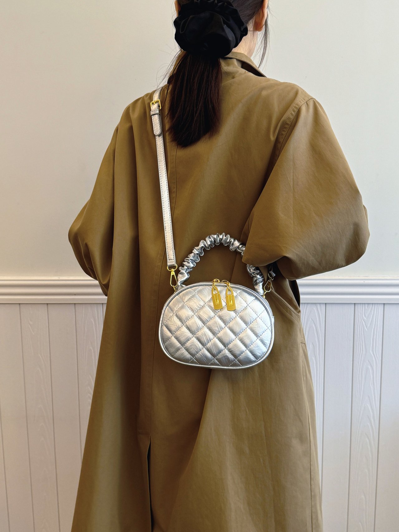 Silver Quilted Crossbody Bag with Gold Accents